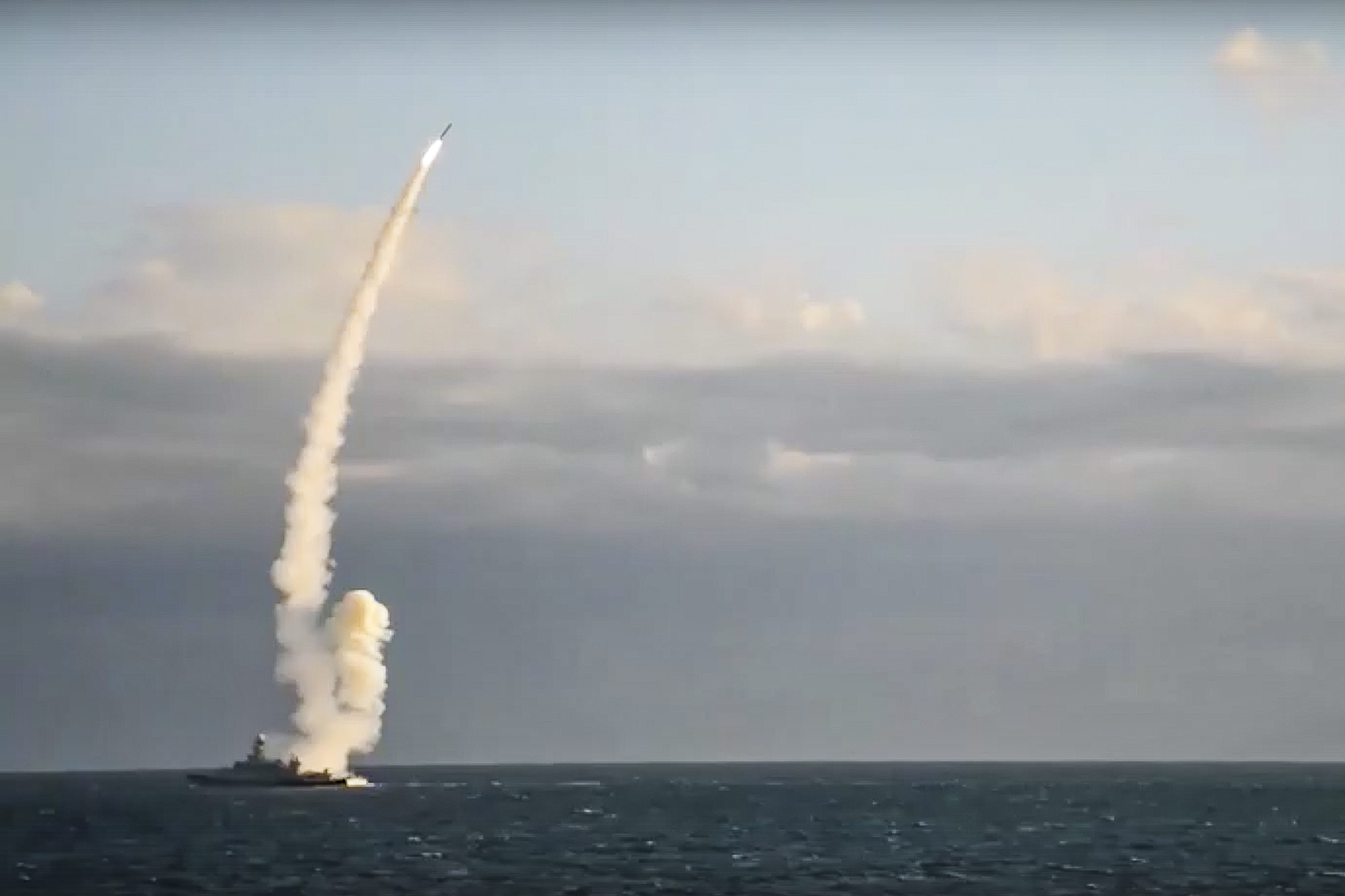In a photo released Monday, a Russian warship launches a cruise missile at a target in Ukraine. A massive barrage of Russian strikes hit critical infrastructure in Kyiv, Kharkiv and other Ukrainian cities on Monday morning, knocking out water and power supplies in apparent retaliation for what Moscow alleged was a Ukrainian attack on its Black Sea Fleet over the weekend.