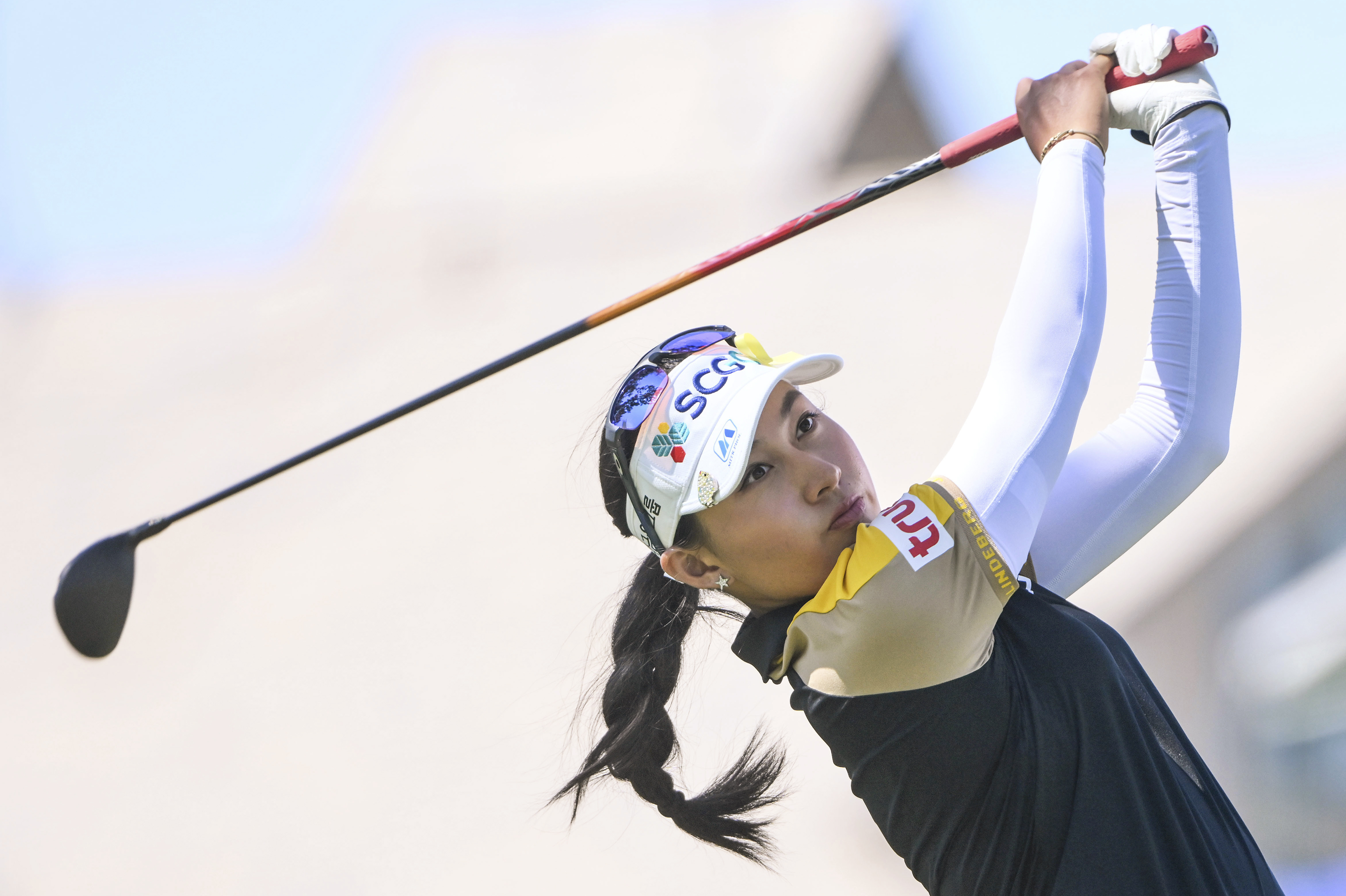 FILE - Atthaya Thitikul of Thailand watches her shot on the 16th hole during the LPGA Walmart NW Arkansas Championship golf tournament on Sept. 25, 2022, in Rogers, Ark. Atthaya Thitikul shot a 9-under 63 on Thursday, Oct. 20, to lead after the first round of the LPGA BMW Ladies Championship in South Korea. She was a stroke ahead of Minsol Kim and three up on a trio of players: A Lim Kim, Andrea Lee, and Yaeeun Hong. 