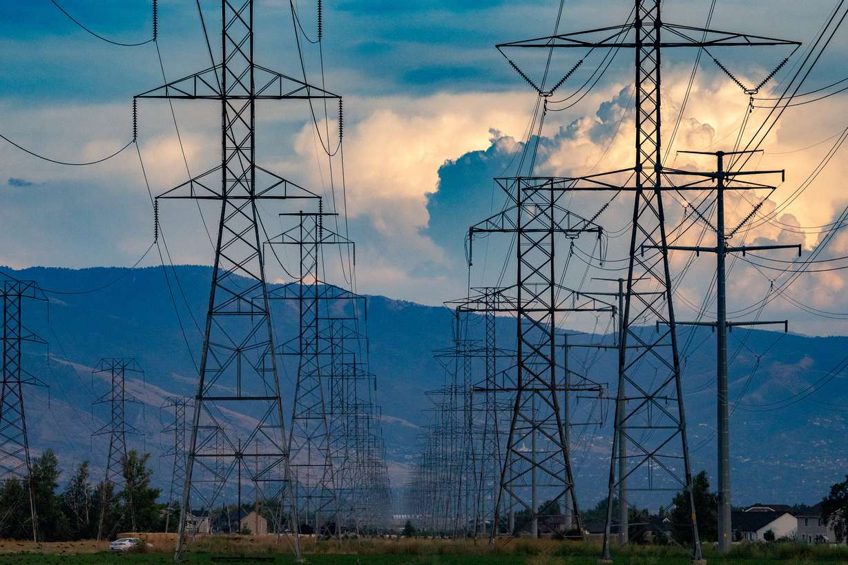 This image shows power lines in the foreground, obscuring the view of mountains in the background.