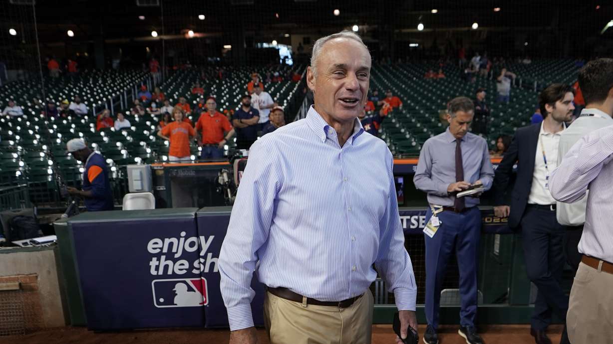 Major League Baseball Commissioner Rob Manfred walks on the field before Game 2 of an American League Division Series baseball game between the Houston Astros and the Seattle Mariners in Houston, Thursday, Oct. 13, 2022.