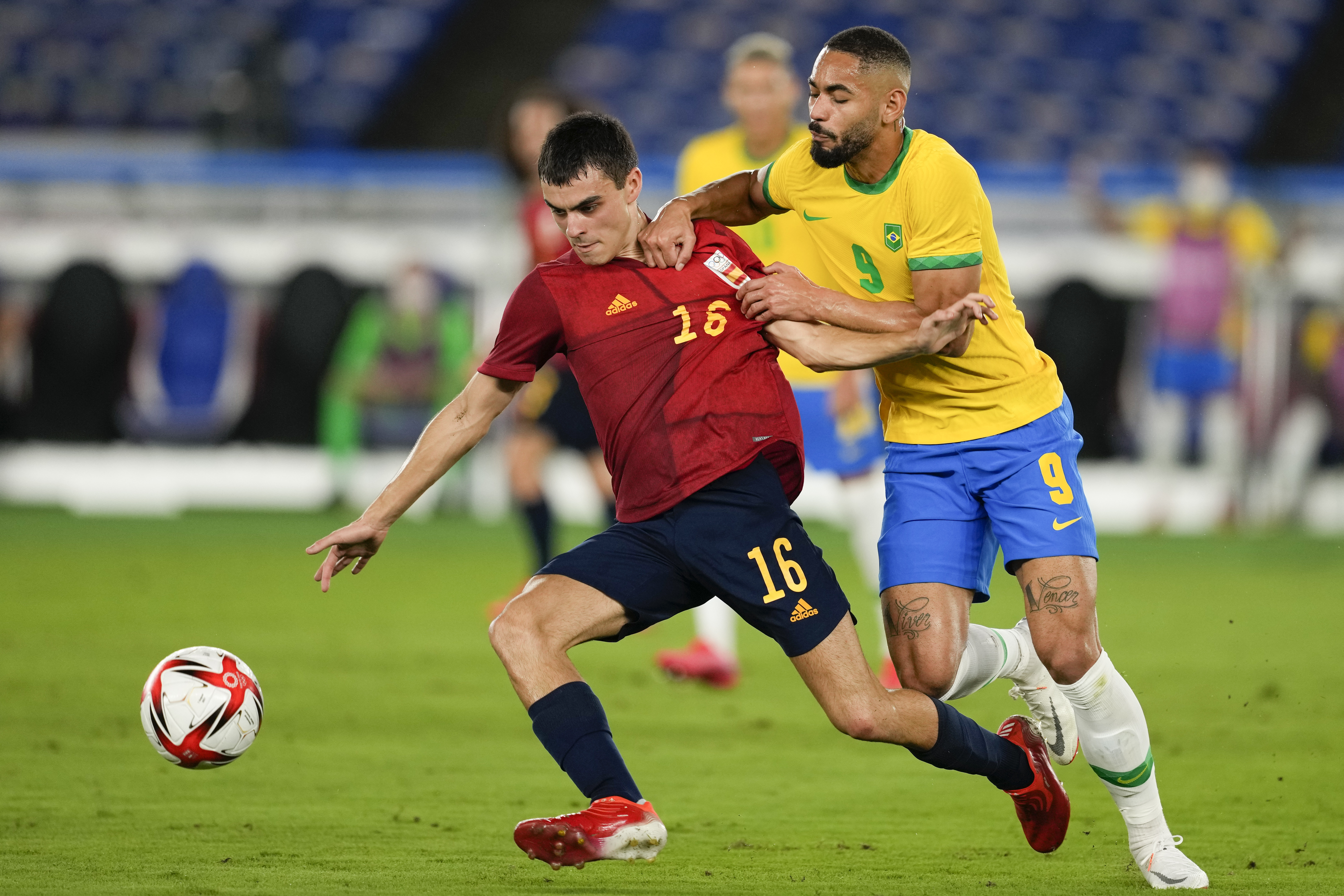 FILE - Spain's Pedri Gonzalez, left, and Brazil's Matheus Cunha battle for the ball during the men's final soccer match at the 2020 Summer Olympics, Saturday, Aug. 7, 2021, in Yokohama, Japan. 
