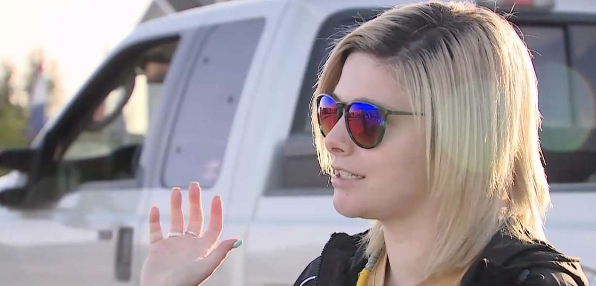 Shailee Brimhall talks about being shot at with a pellet gun by another driver during a road rage incident on I-15 on Monday.