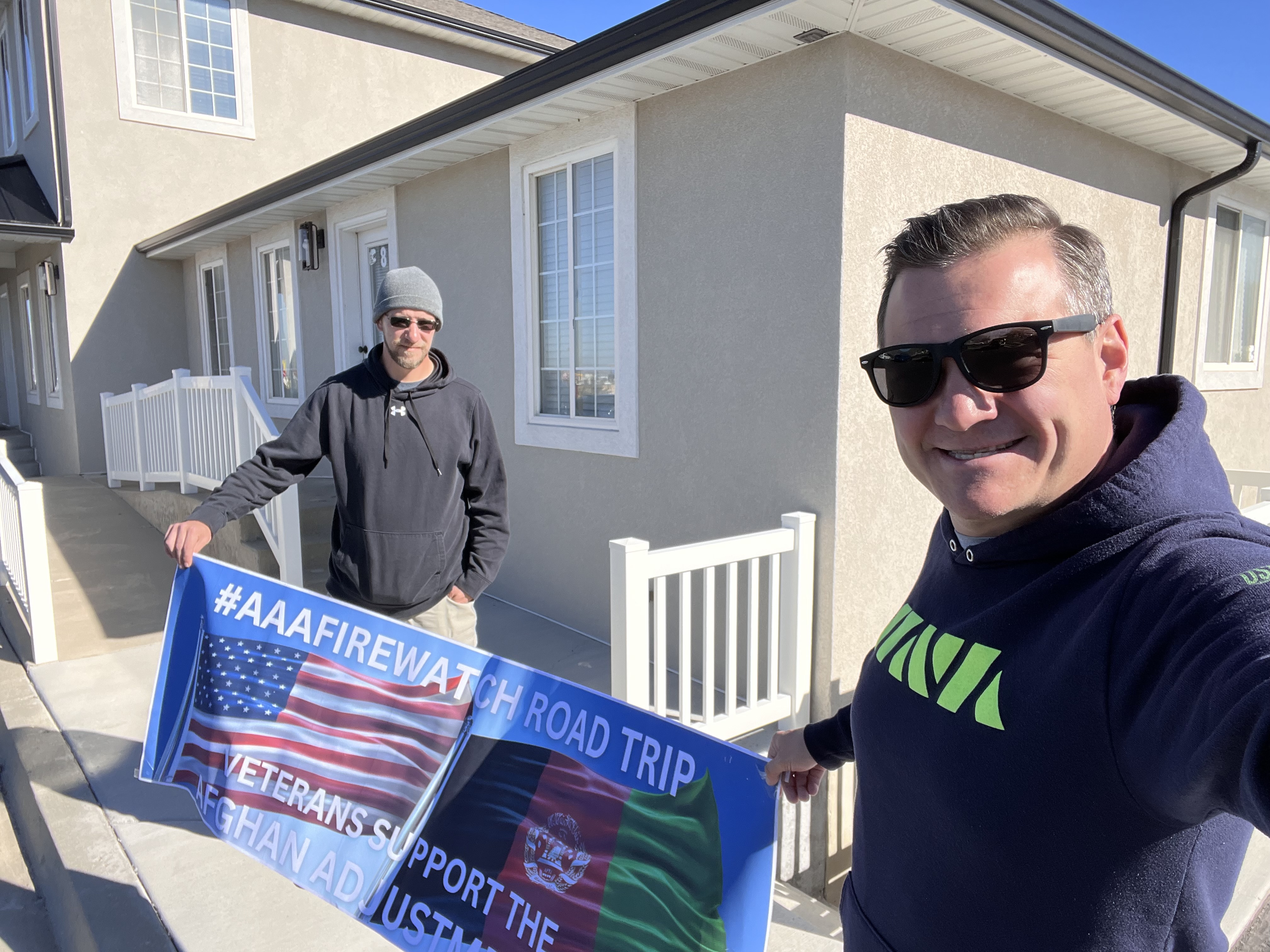 James Powers, Left, and Matt Zeller in front of Utah Sen. Mitt Romney's office in Spanish Fork.