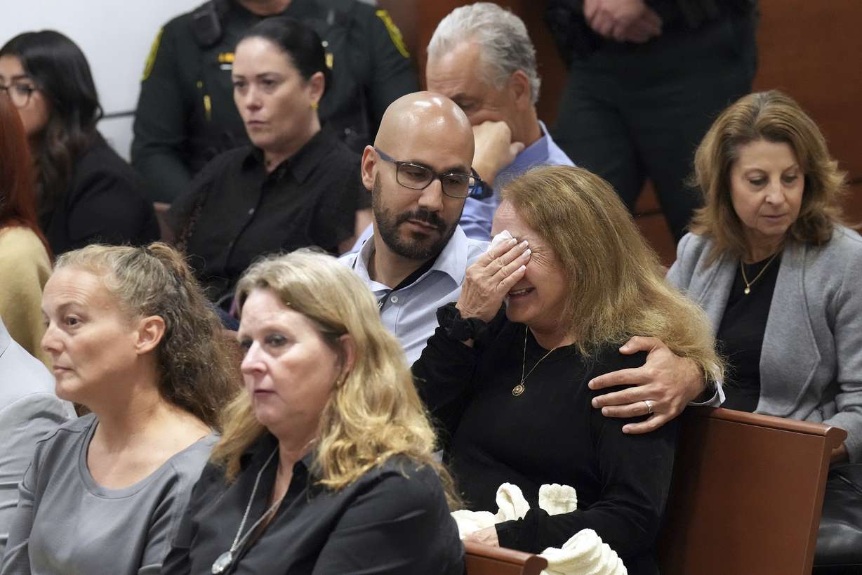 Teresa Robinovitz is consoled after presenting her victim impact statement in the sentencing hearing for Marjory Stoneman Douglas High School shooter Nikolas Cruz at the Broward County Courthouse in Fort Lauderdale, Fla. on Tuesday, Nov. 1. Robinovitz's granddaughter, Alyssa, was killed in the 2018 shootings.