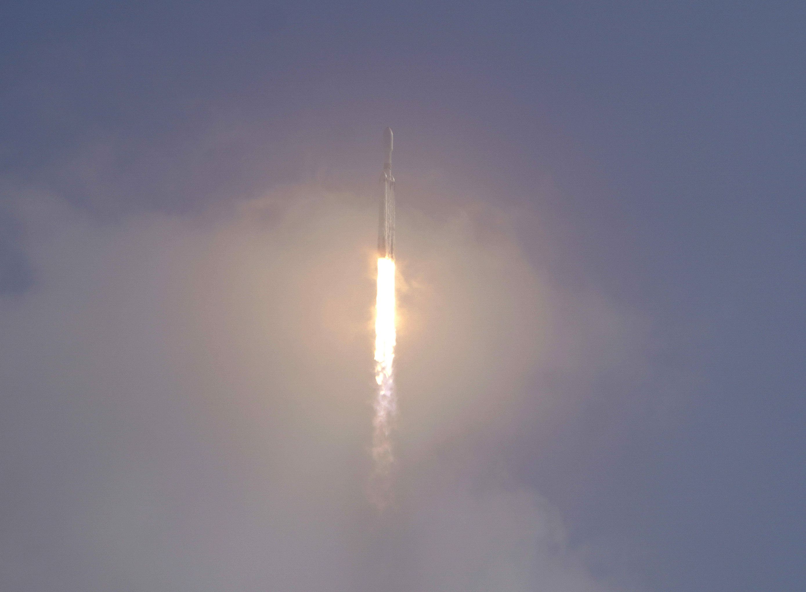 A SpaceX Falcon Heavy rocket lifts off from pad 39A at the Kennedy Space Center in Cape Canaveral, Florida, on Tuesday.