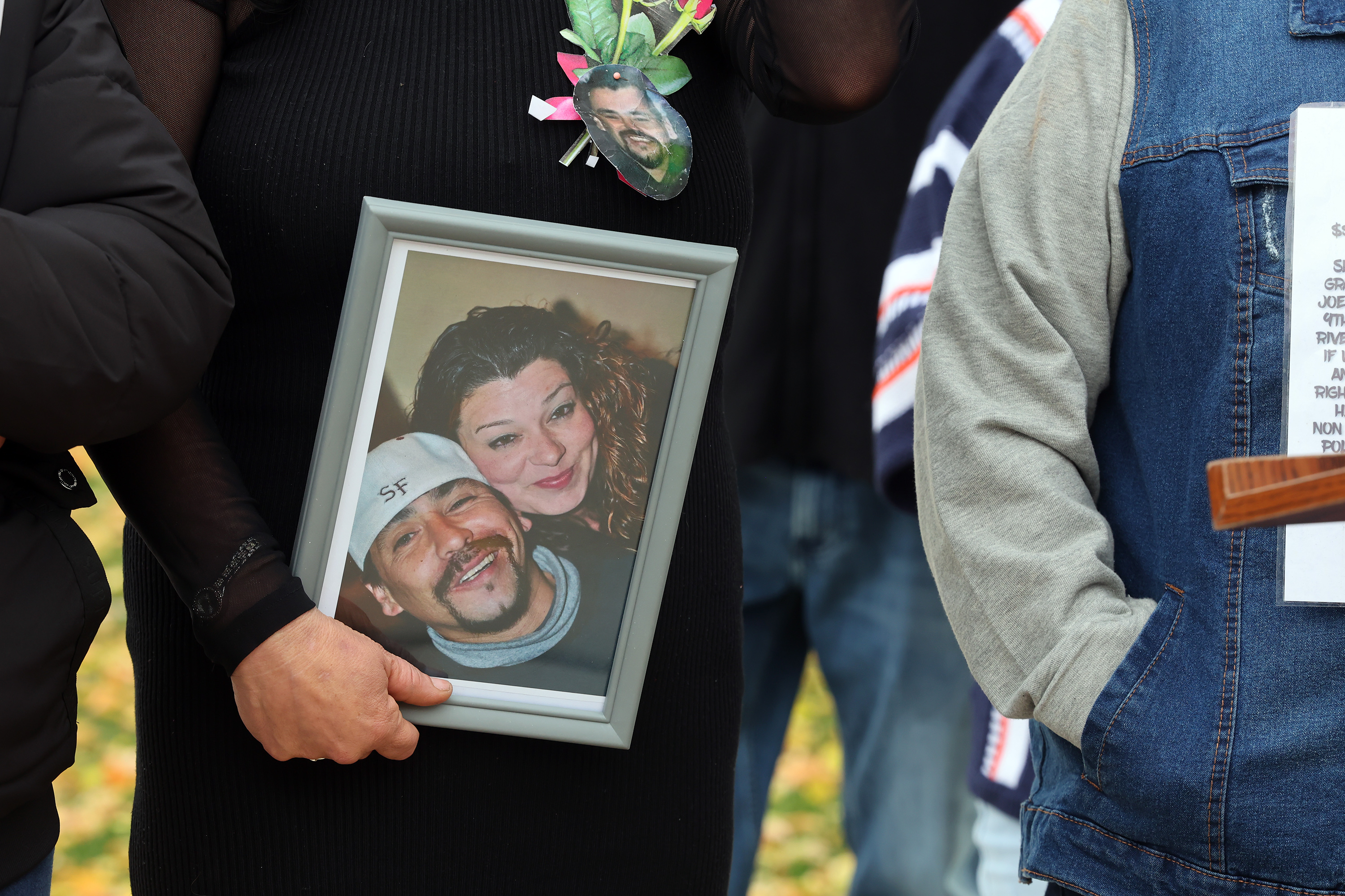 Heather Ramos holds a photo of her husband, Joseph Salas, during a press conference near North Temple and the Jordan River in Salt Lake City on Tuesday. Salas’ body was found in the Jordan River more than a year ago, and his family is asking for help in finding answers in his death.