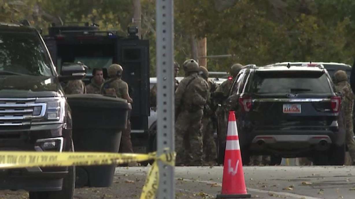 A SWAT team responds to a West Bountiful residence near 200 North and 800 West following a domestic violence incident on Tuesday. Nearby residents were told to shelter in place.
