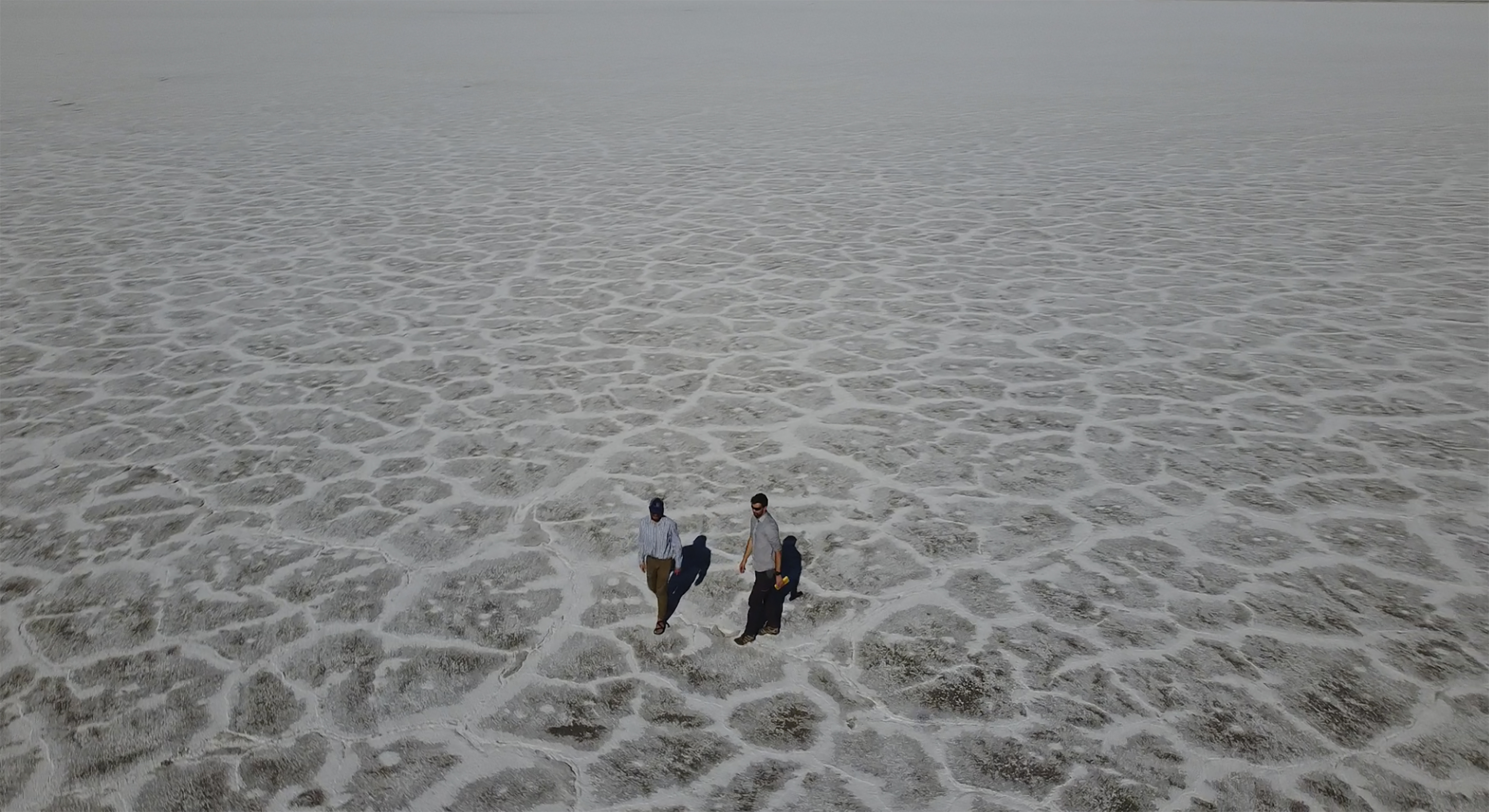 Utah Department of Natural Resources geologists Paul Inkenbrandt, left, and Jeremiah Bernau walk along the Bonneville Salt Flats on Aug. 29, near Wendover. The glistening white salt of the world-famous area is shrinking near the Utah-Nevada line.