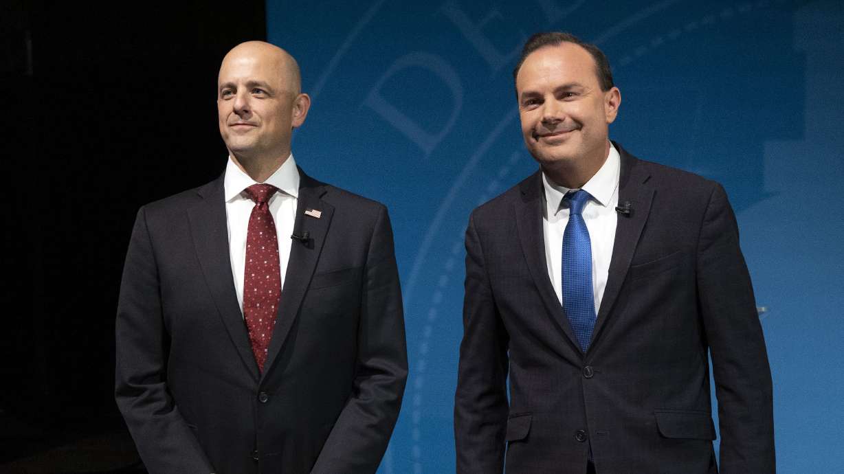 Independent Senate candidate Evan McMullin and incumbent Republican Sen. Mike Lee Lee pose for photos prior to their debate at UVU in Orem on Oct. 17. This race is perhaps the most expensive in state history.