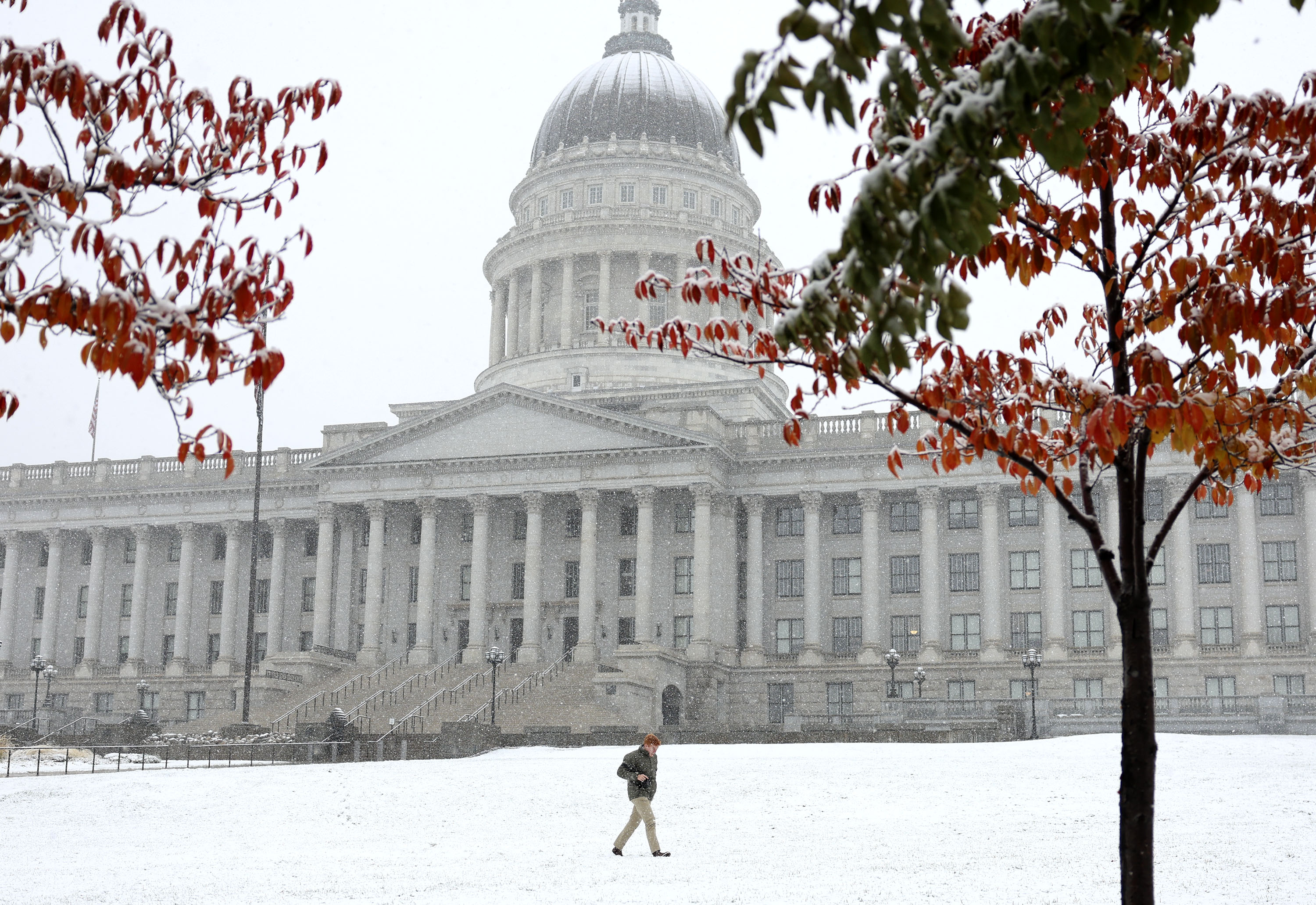 Jackson Murphy walks around while taking photographs of the state Capitol in Salt Lake City on Wednesday.