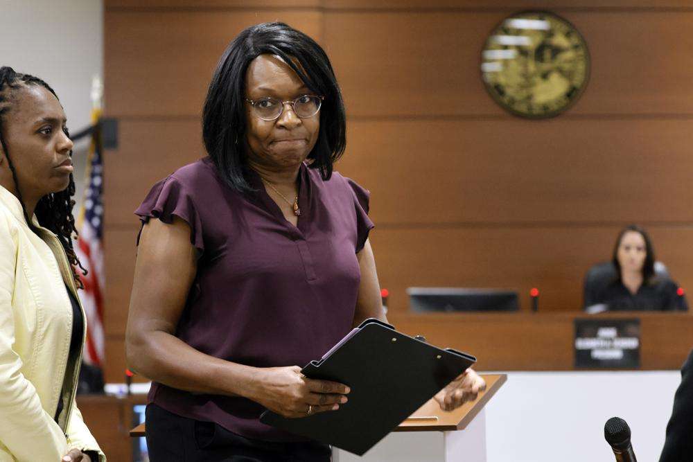 Anne Marie Ramsay leaves the podium after giving her victim impact statement in the sentencing hearing for Marjory Stoneman Douglas High School shooter Nikolas Cruz at the Broward County Courthouse in Fort Lauderdale, Fla. on Tuesday. Ramsay's daughter, Helena, was killed in the 2018 shootings. Cruz was sentenced to life in prison for murdering 17 people at Parkland's Marjory Stoneman Douglas High School more than four years ago.