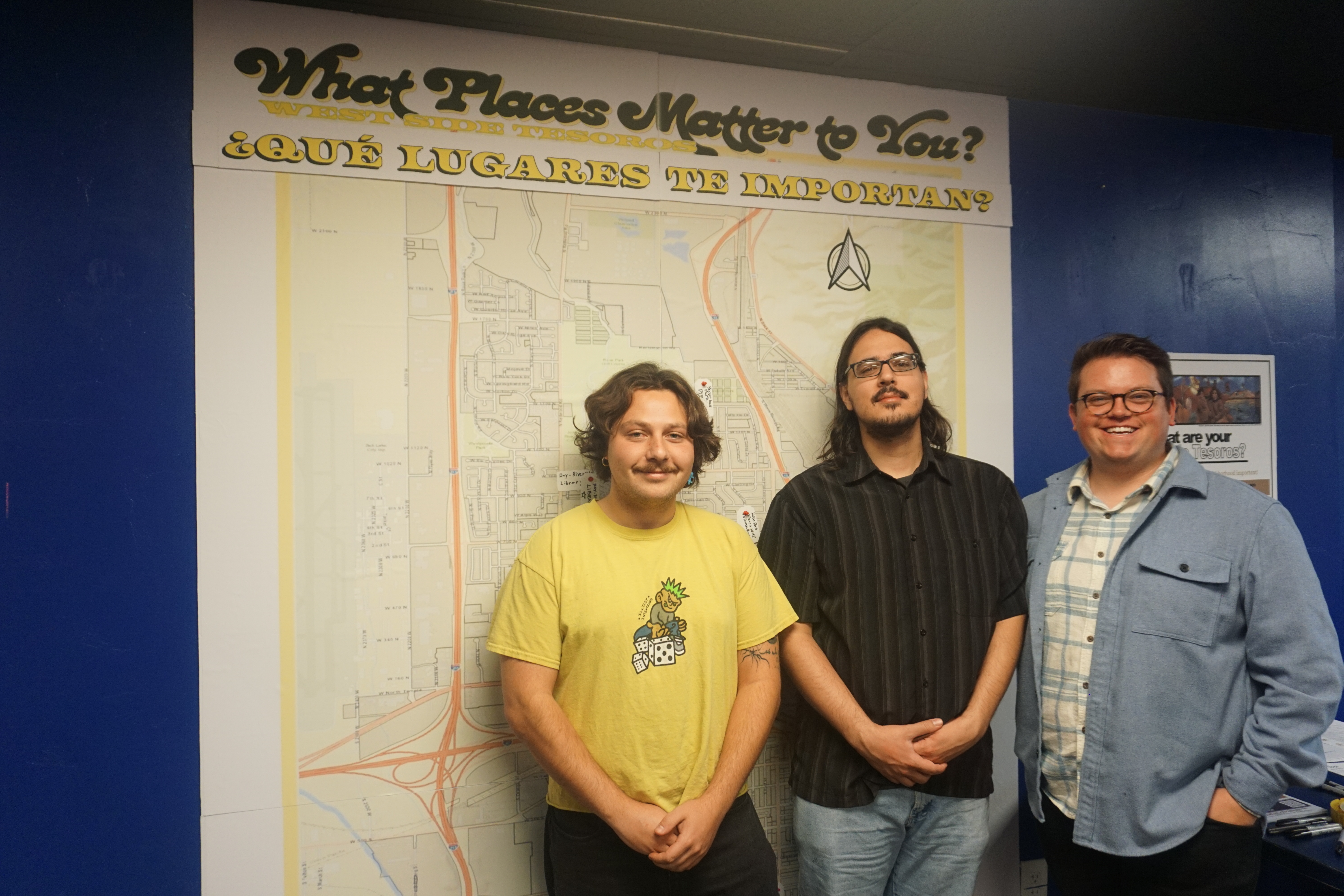 Graduate students of University of Utah's City and Metropolitan Planning Department pose in front of a West Side community map on Wednesday. The map is part of a collaboration between Neighborworks Salt Lake and the University of Utah.