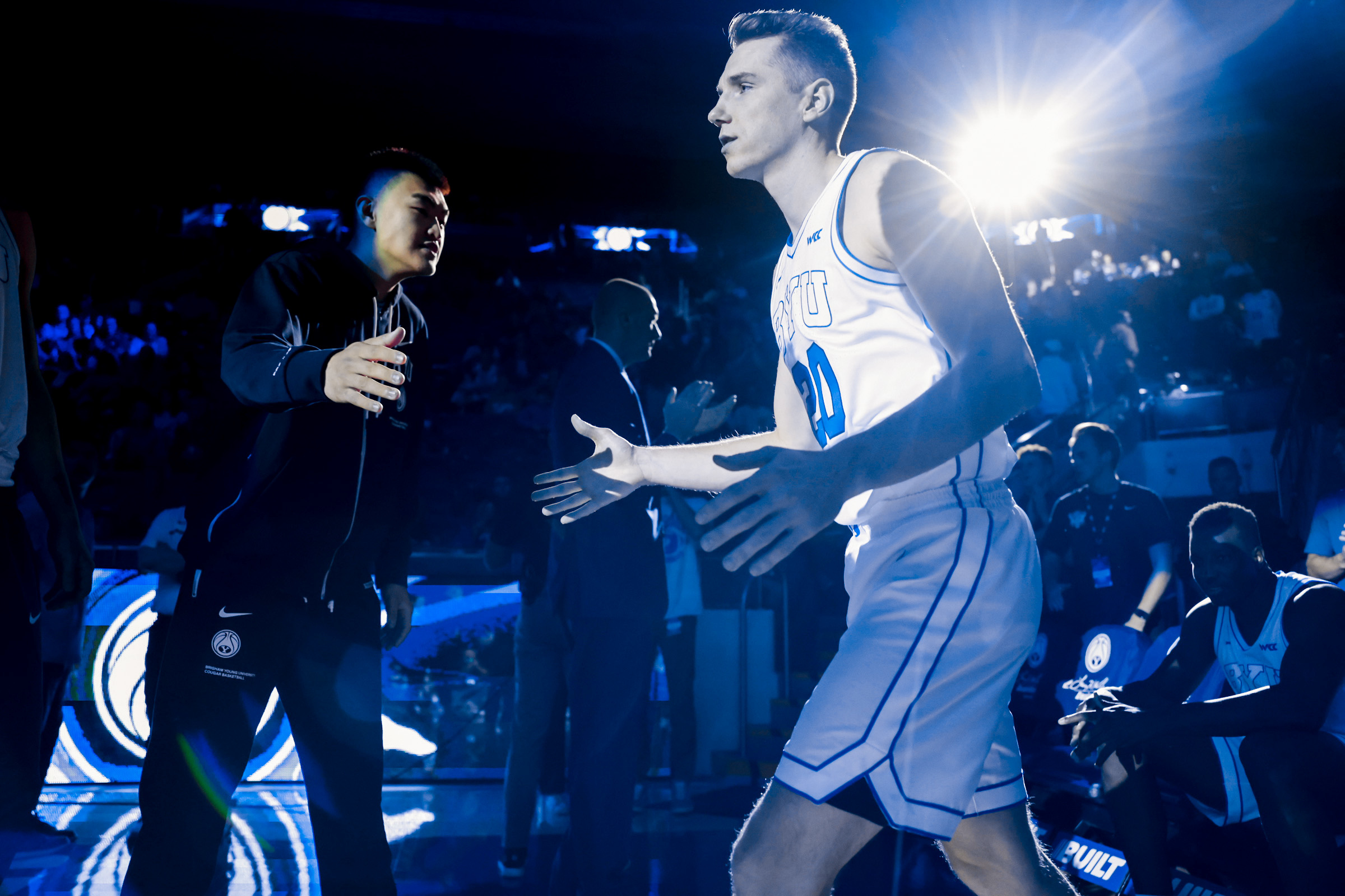 BYU wing Spencer Johnson slaps palms with freshman Hao Dong before the Cougars' 109-69 exhibition win over Ottawa (Ariz.), Wednesday, Nov. 2, 2022 in the Marriott Center in Provo.