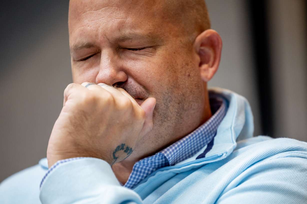Joe Petito, father of Gabby Petito, listens as Gabby’s mother, Nichole Schmidt, speaks during a press conference at the Utah Law and Justice Center in Salt Lake City on Thursday. Petito’s parents and attorneys announced they have filed a $50 million wrongful death lawsuit against the Moab Police Department.
