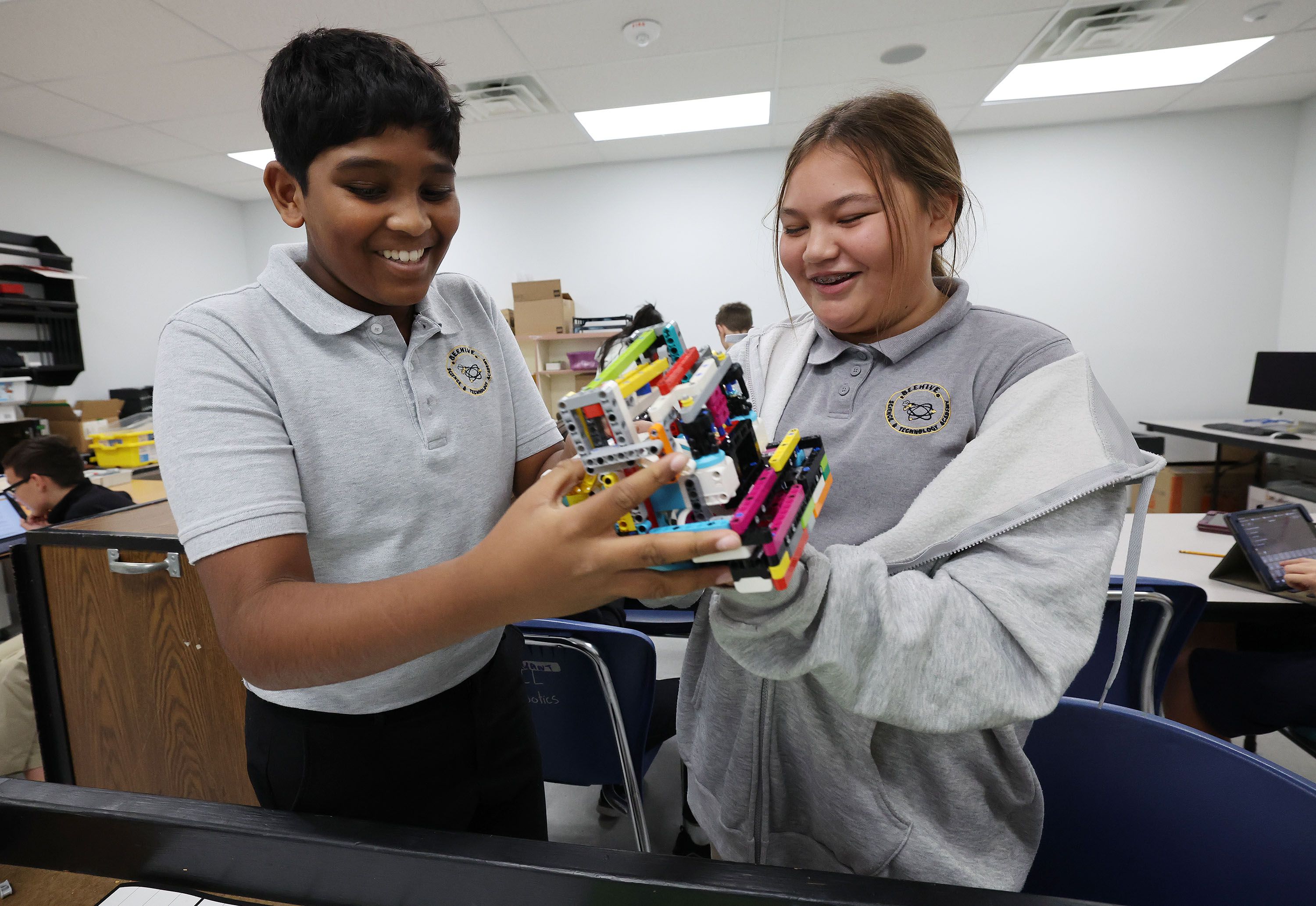 Divan Narsipuram and Lilly Ostler work with an autonomous robot at the Beehive Science and Technology Academy in Sandy on Thursday. Twelve percent of Utah school kids attend public charter schools.