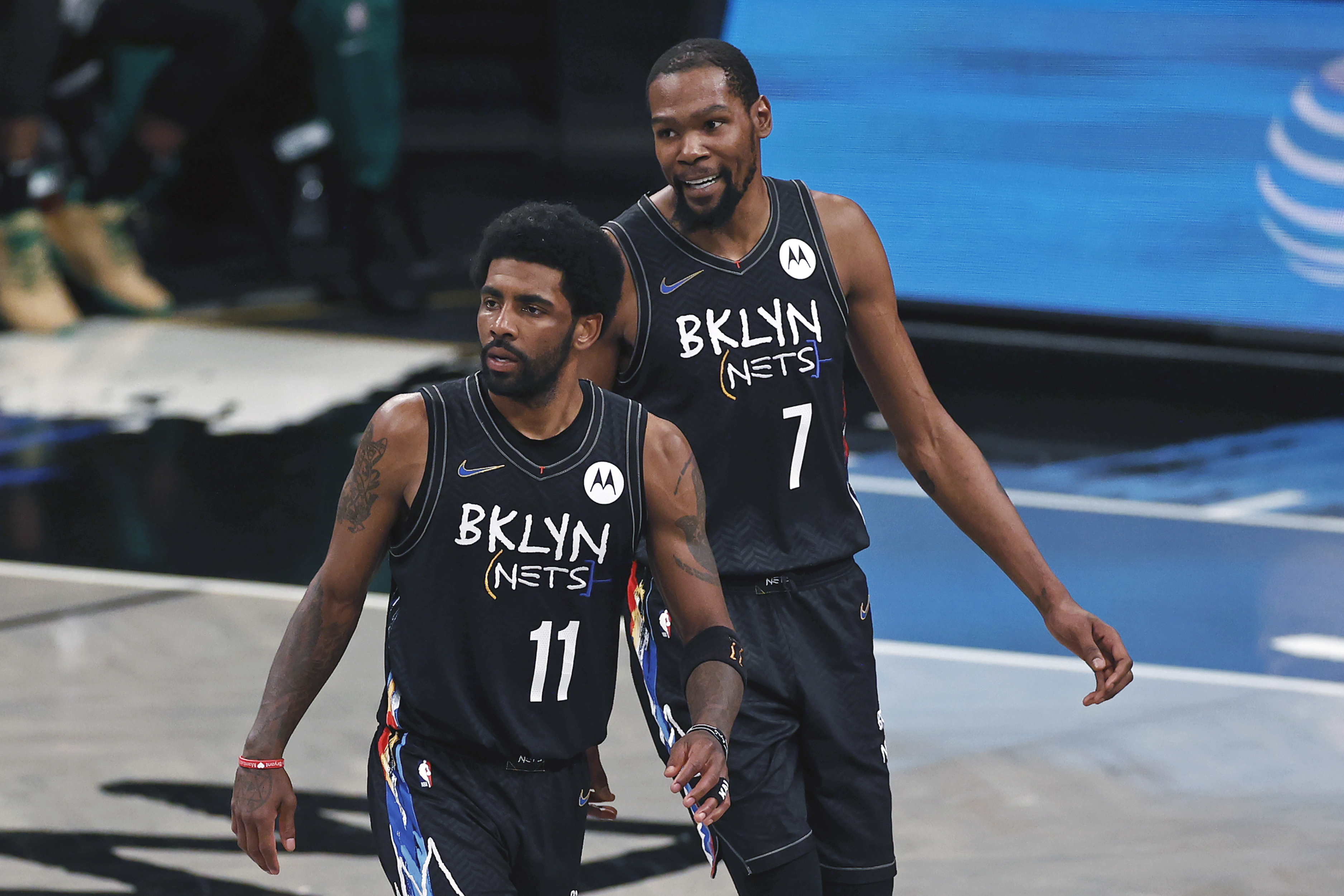 FILE - Brooklyn Nets guard Kyrie Irving (11) and Kevin Durant react against the Boston Celtics in the second half of Game 5 during an NBA basketball first-round playoff series, June 1, 2021, in New York. Kevin Durant said Friday, Nov. 4, 2022, the Brooklyn Nets could have handled this tumultuous week a bit differently — a week in which his coach was fired and teammate Kyrie Irving was suspended for posting a link to an antisemitic work.  