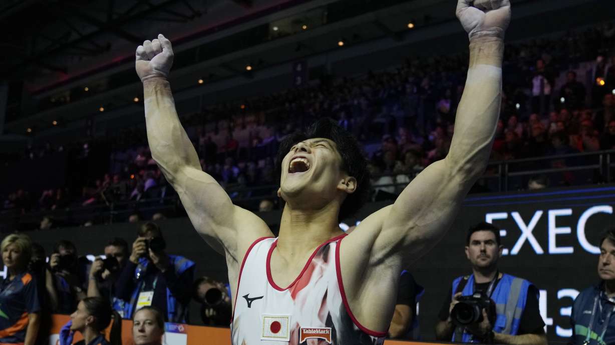 Daiki Hashimoto of Japan celebrates as he won the gold medal at the Men's All-Around Final during the Artistic Gymnastics World Championships at M&S Bank Arena in Liverpool, England, Friday, Nov. 4, 2022.