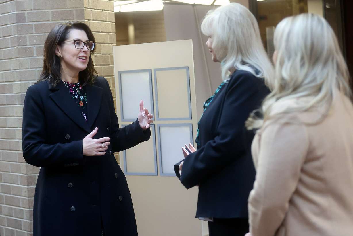 Lt. Gov. Deidre Henderson, left, talks with Salt Lake County Clerk Sherrie Swenson and Salt Lake County chief deputy clerk Lannie Chapman during early voting at the Salt Lake County Government Center in Salt Lake City on Thursday. Henderson has been outspoken about the importance of trusting in the election process and making your voice heard by voting.