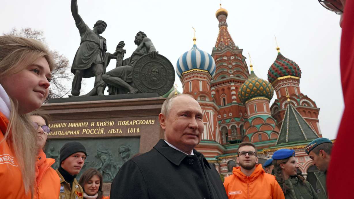 Russian President Vladimir Putin speaks while marking Russia's Day of National Unity in Red Square in central Moscow on Friday. Putin has publicly endorsed the evacuation of civilians from parts of Ukraine's southern Kherson region.