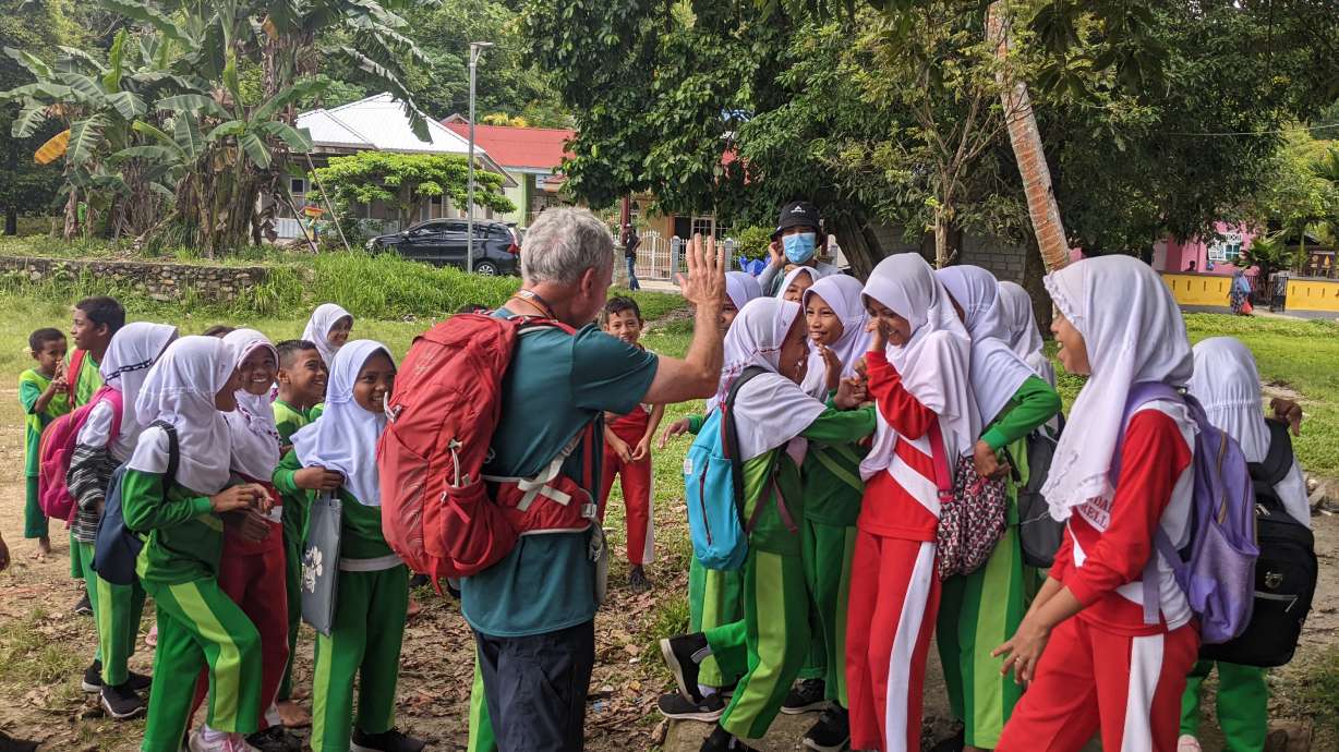 BYU geology professor Ron Harris talks with schoolchildren in Indonesia about the 2019 earthquake and what to do during an earthquake or when there's risk of a tsunami. Harris and his students visited Indonesia most recently in August to help implement disaster risk reduction.