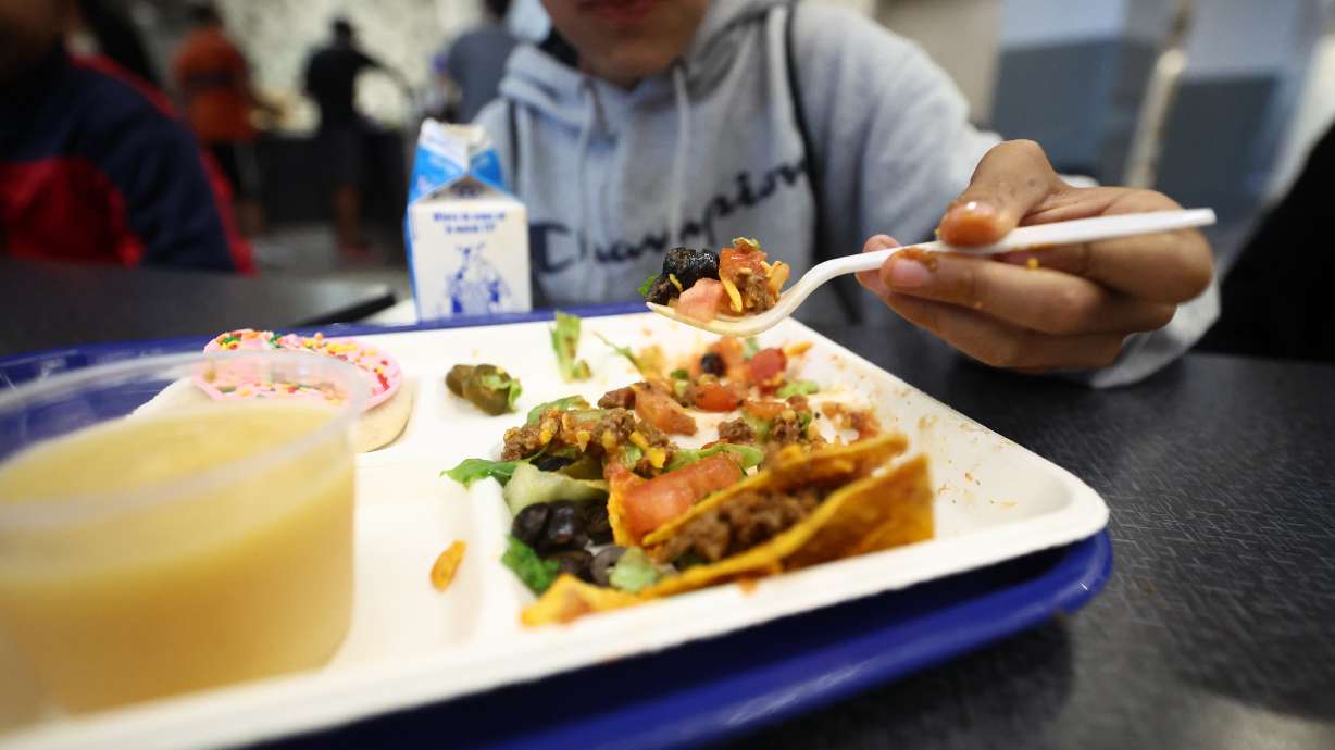 A student eats his lunch at Midvale Middle School on Aug. 16. Rising inflation is impacting the prices of school lunches for many kids across the country. But some districts in Utah have been able to keep their school lunch prices steady.