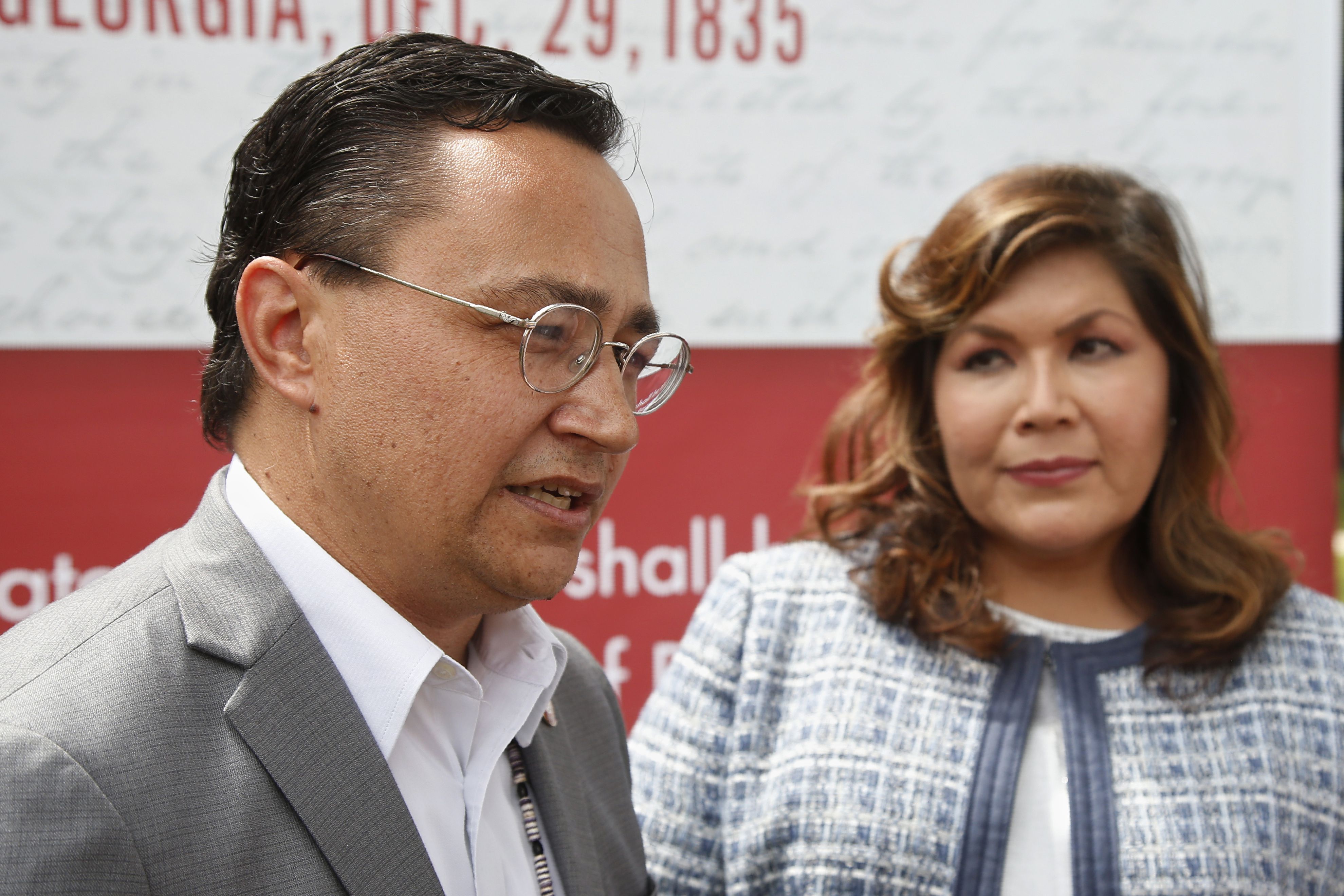 Cherokee Nation Principal Chief Chuck Hoskin Jr., left, answers a question for the media following his announcement that he is nominating Kimberly Teehee, right, as a Cherokee Nation delegate to the U.S. House, in Tahlequah, Okla., on Aug. 22, 2019.