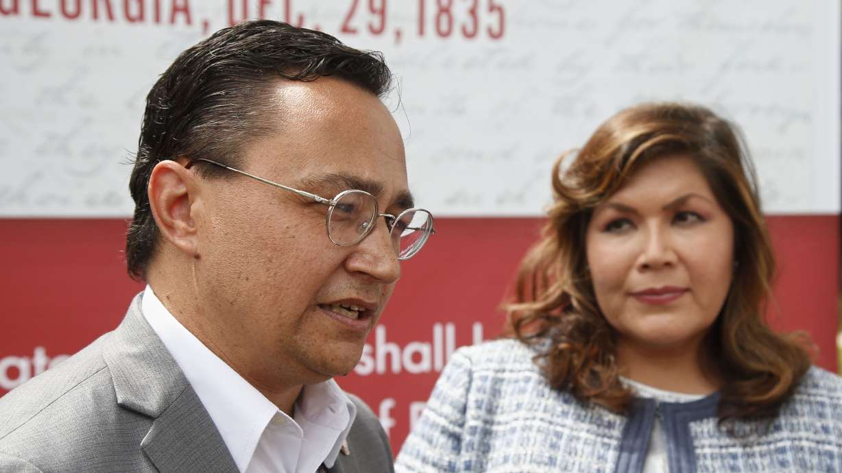Cherokee Nation Principal Chief Chuck Hoskin Jr., left, answers a question for the media following his announcement that he is nominating Kimberly Teehee, right, as a Cherokee Nation delegate to the U.S. House, in Tahlequah, Okla., on Aug. 22, 2019.