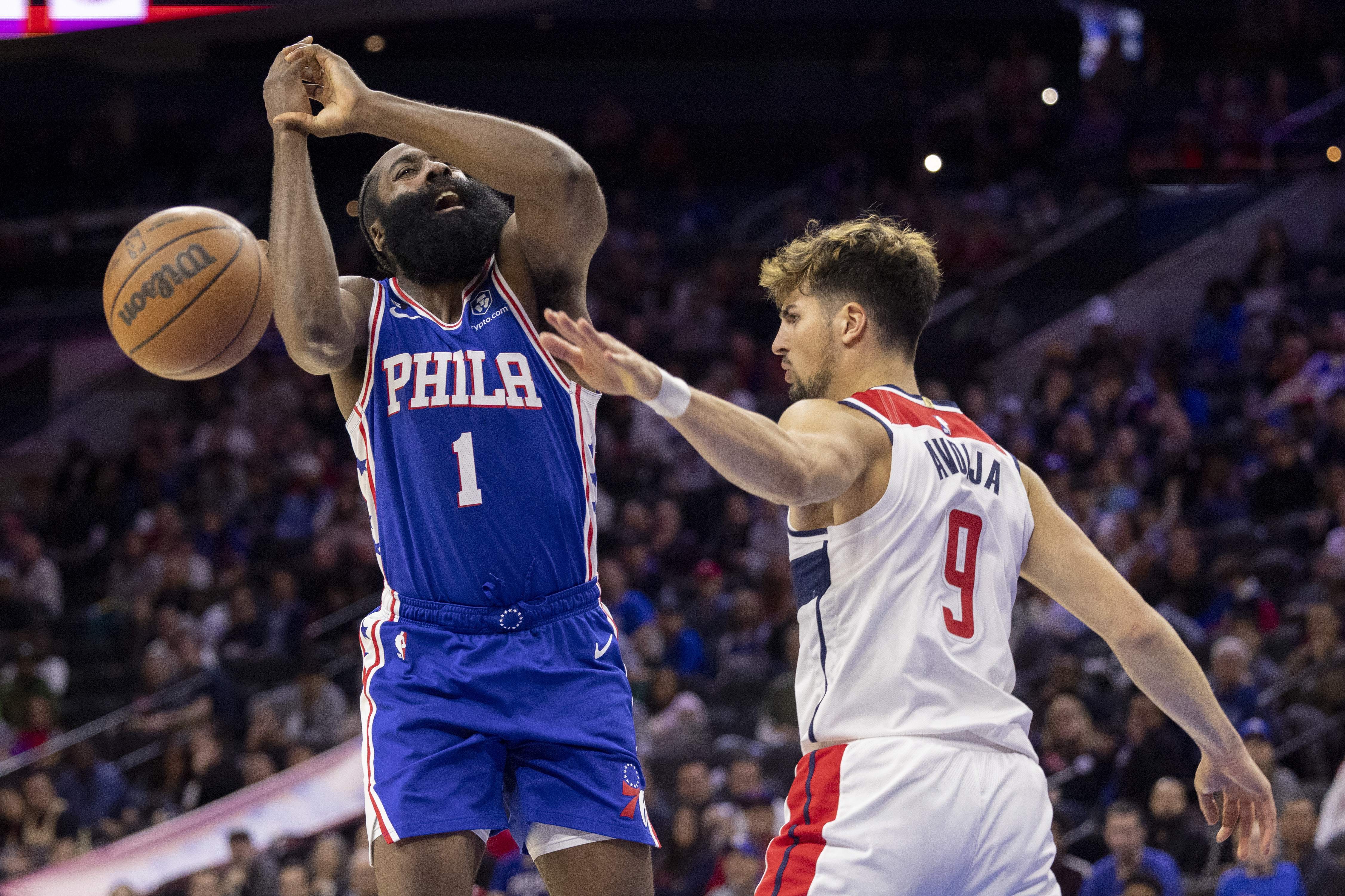 Washington Wizards forward Deni Avdija (9) blocks a shot by Philadelphia 76ers guard James Harden (1) during the second half of an NBA basketball game Wednesday, Nov. 2, 2022, in Philadelphia.