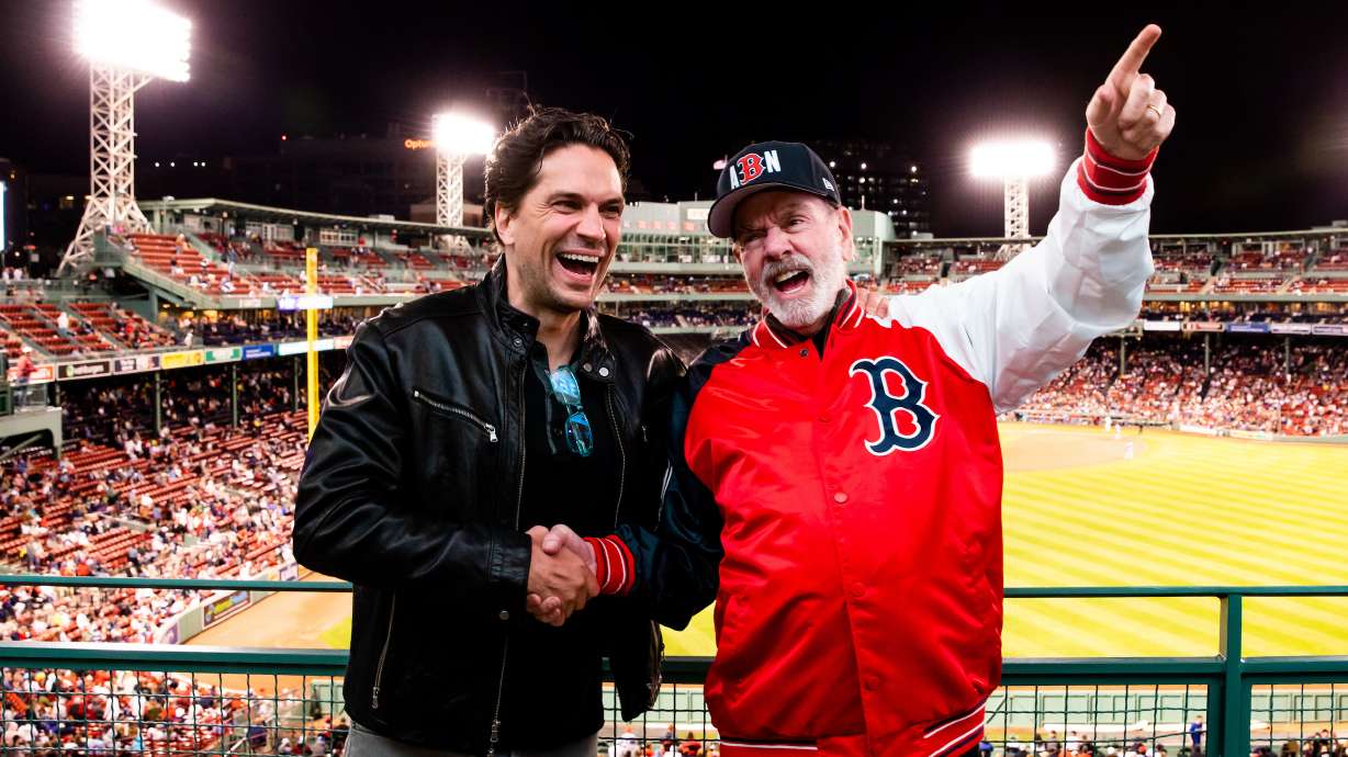 Will Swenson, left, stands with Neil Diamond at a Boston Red Sox game. Swenson is playing Diamond in the Broadway musical “A Beautiful Noise: A Neil Diamond Musical.”