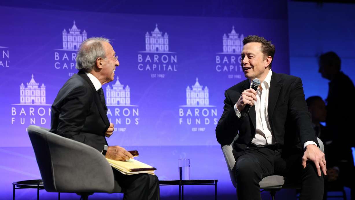 Baron Capital Group Chairman Ron Baron interviews new Twitter owner Elon Musk in New York City on Friday. Twitter on Saturday launched a subscription service for $7.99 a month that includes a blue check now given only to verified accounts as Musk overhauls the platform's verification system