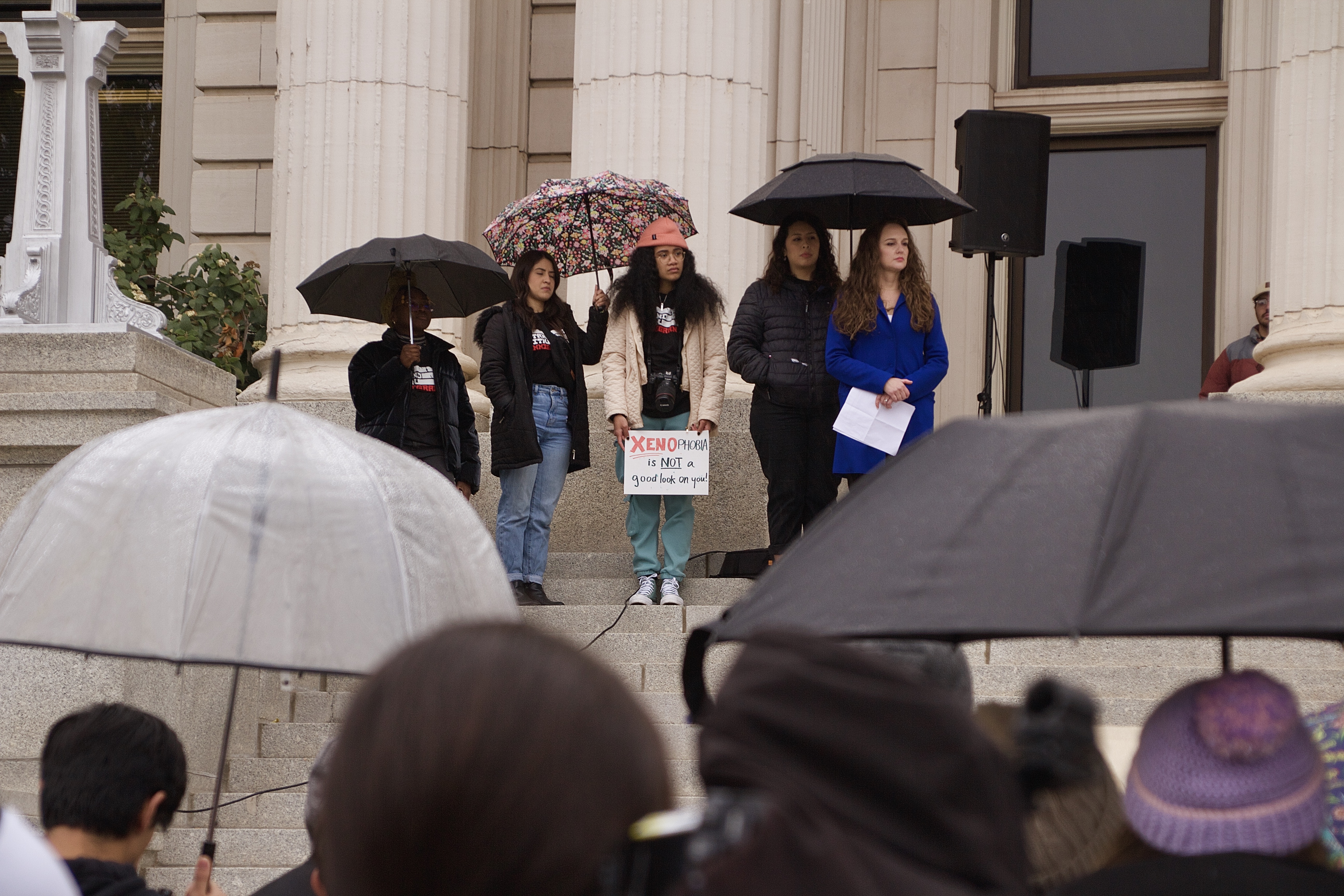 Organizers and speakers stand in front of the Provo Historic Courthouse during a Stand With All Immigrants Utah rally on Saturday.