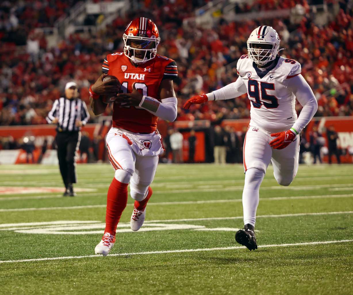 Utah Utes running back Nate Johnson (13) takes the ball into the end zone for a touchdown as Utah and Arizona play at Rice Eccles Stadium in Salt Lake City on Saturday, Nov. 5, 2022.