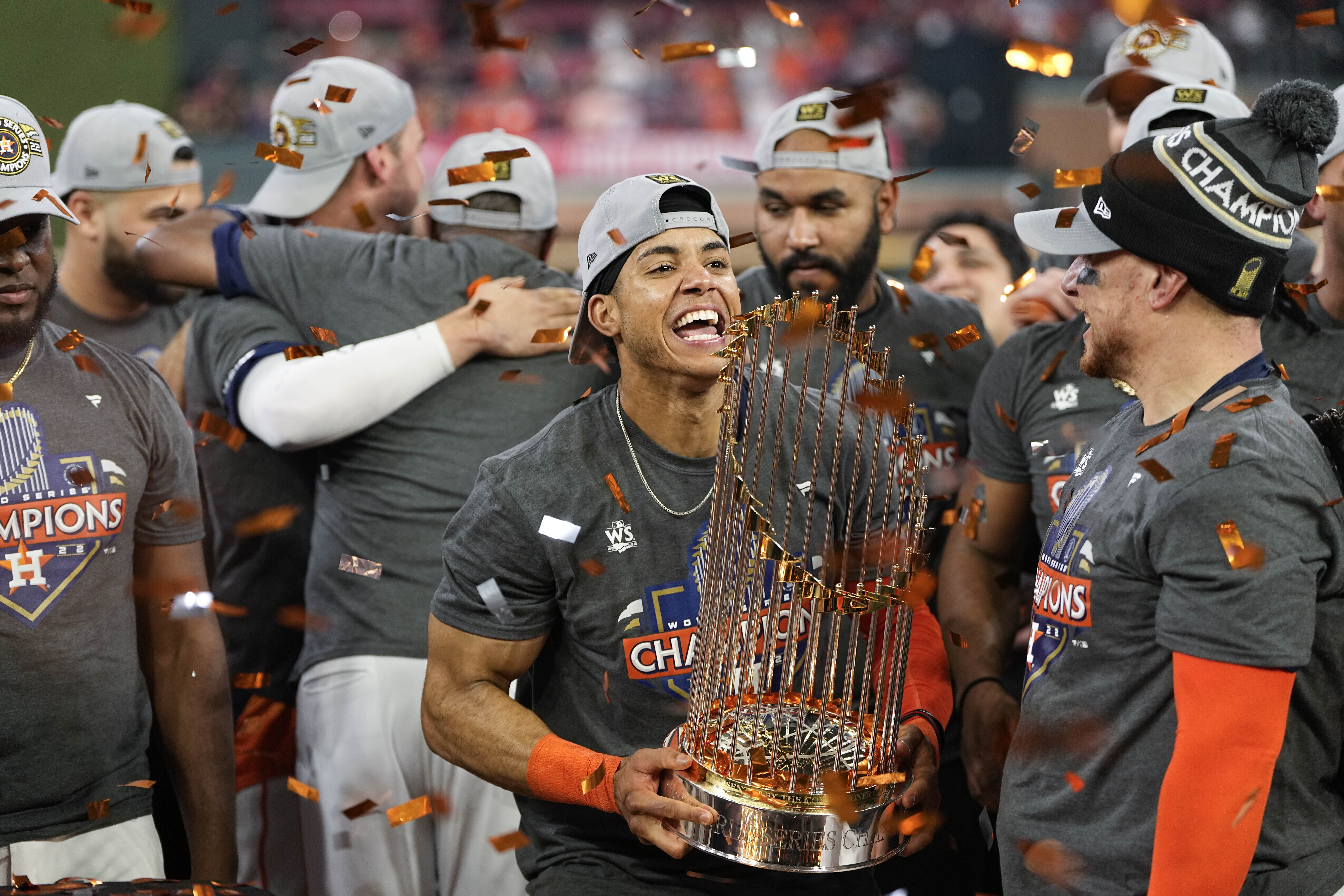 Houston Astros shortstop Jeremy Pena celebrates with the trophy after their 4-1 World Series win against the Philadelphia Phillies in Game 6 on Saturday, Nov. 5, 2022, in Houston. 