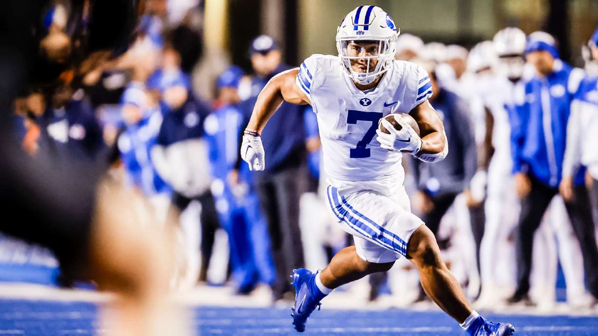 BYU running back Hinckley Ropati rushes for yardage during the Cougars' 31-28 win over Boise State, Saturday, Nov. 6, 2022 in Boise, Idaho.