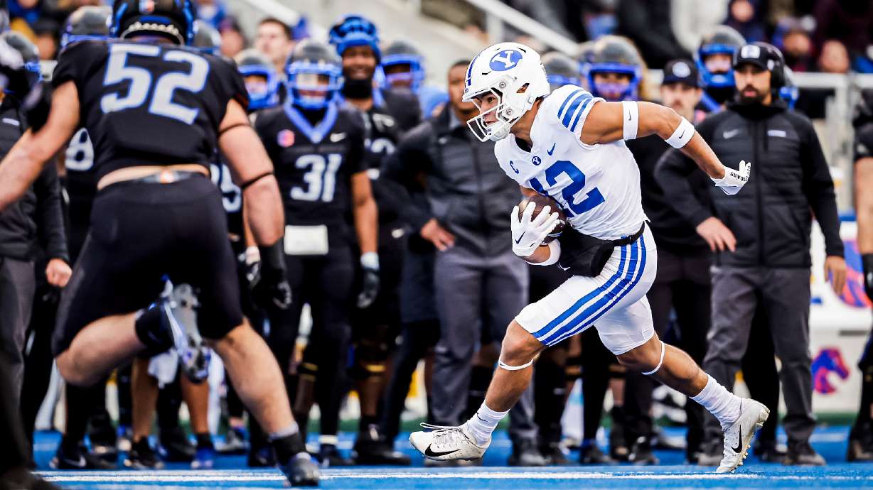 BYU wide receiver Puka Nacua (12) runs for more yardage during the Cougars' 31-28 win over Boise State, Saturday, Nov. 5, 2022 in Boise, Idaho.
