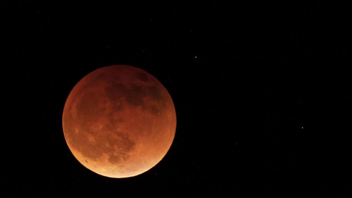 The moon is shown during a full lunar eclipse May 15, near Moscow, Idaho. A Tuesday total lunar eclipse will be visible throughout North America in the predawn hours — the farther west, the better — and across Asia, Australia and the rest of the Pacific after sunset.
