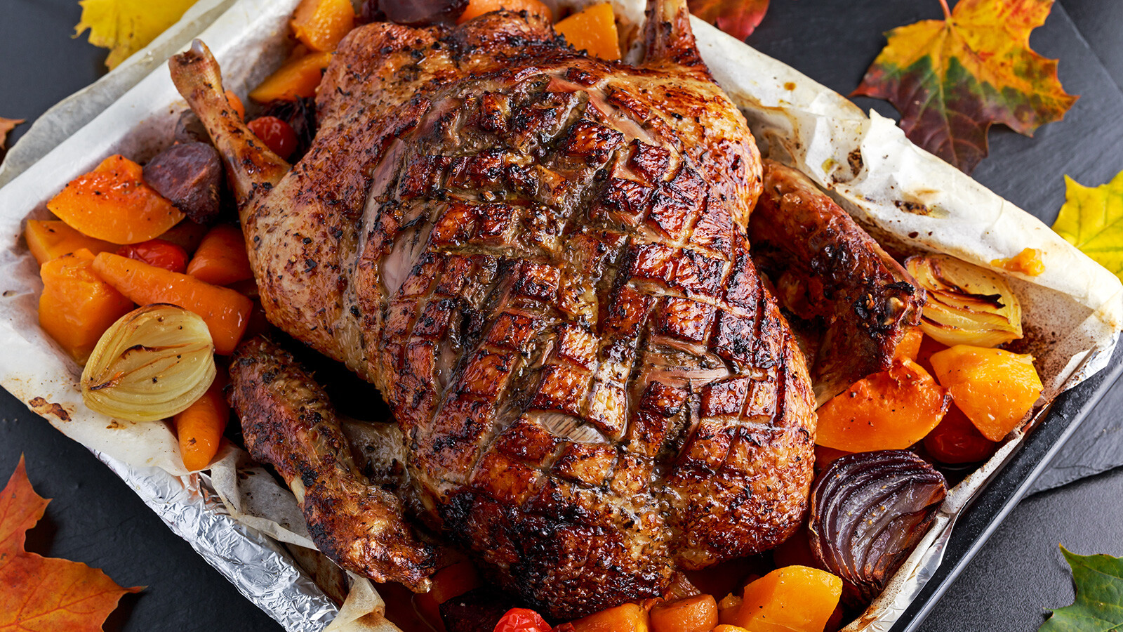 Need a replacement bird at Thanksgiving? Duck roast with baked vegetables is one alternative to turkey.