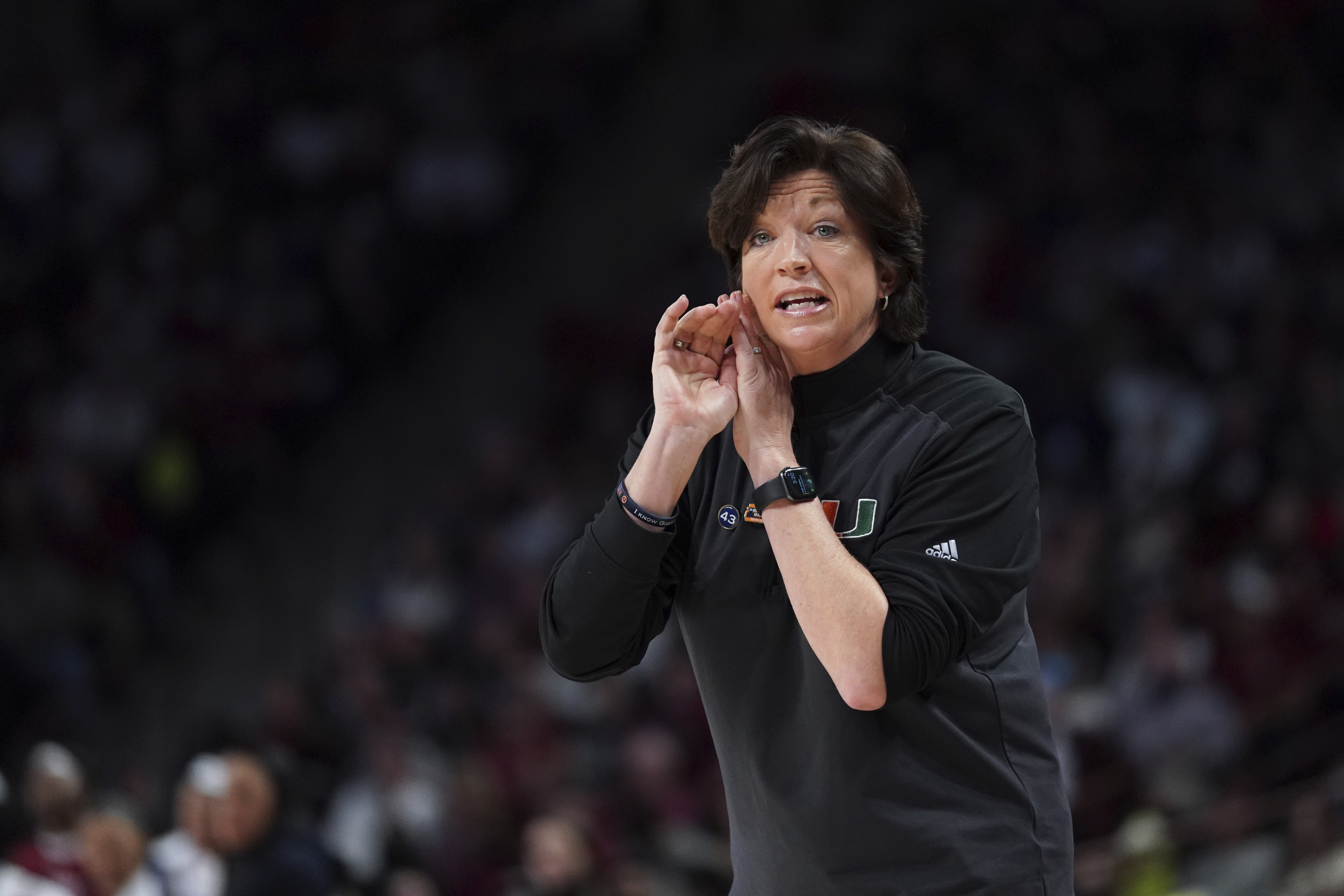 Miami head coach Katie Meier communicates with players during the first half a second-round game against South Carolina in the NCAA college basketball tournament, March 20, 2022 in Columbia, S.C. Meier will miss her team's first three games of the season while the Hurricanes and the NCAA work through an enforcement investigation. 