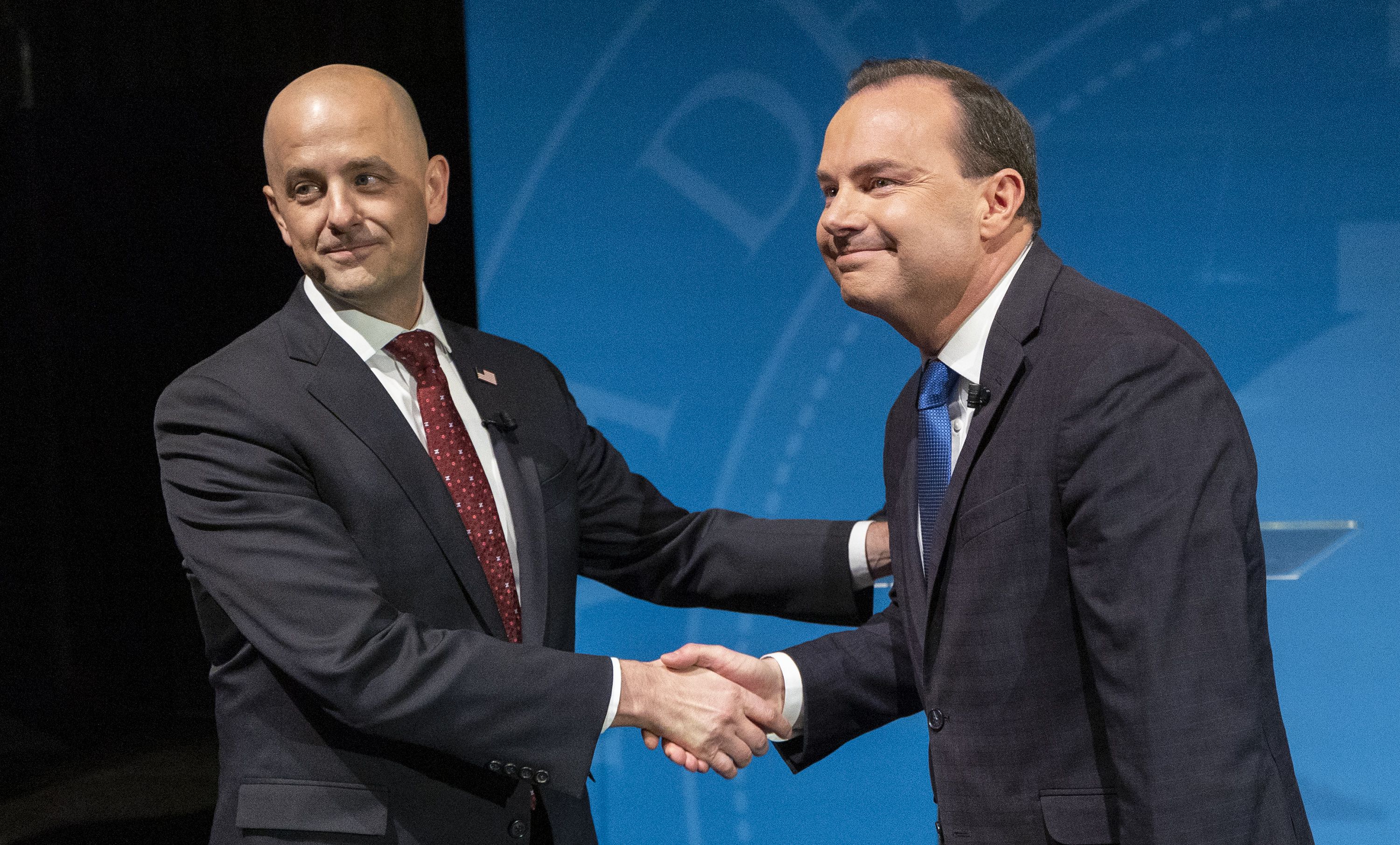 Independent candidate Evan McMullin, left, and Sen. Mike Lee, R-Utah, shake hands prior to their debate at Utah Valley University in Orem on Oct. 17.