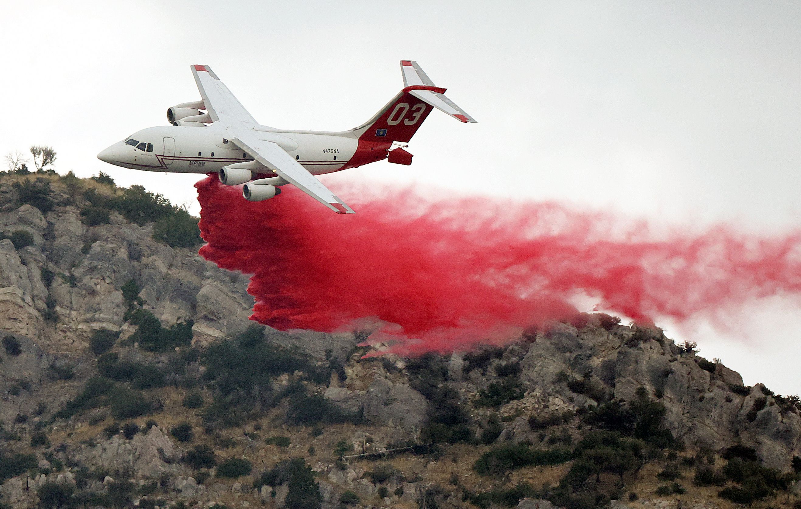 A plane drops fire retardant on a wildfire in Springville on Aug. 1. Drought, wildfire, flooding, record-breaking heat, dismal snowpack and even extreme flash floods are some of the extreme weather events that will be discussed at the 2022 United Nations Climate Change Conference in Egypt this month.