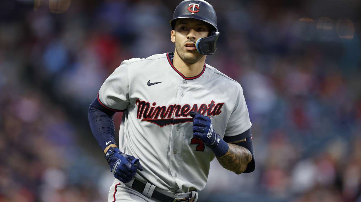 FILE - Minnesota Twins' Carlos Correa rounds the bases after hitting a two-run home run against the Cleveland Guardians during the seventh inning of a baseball game Monday, June 27, 2022, in Cleveland. Minnesota Twins shortstop Carlos Correa formally opted out of his contract to become a free agent, the MLB Players' Association announced Monday, Nov. 7, 2022.