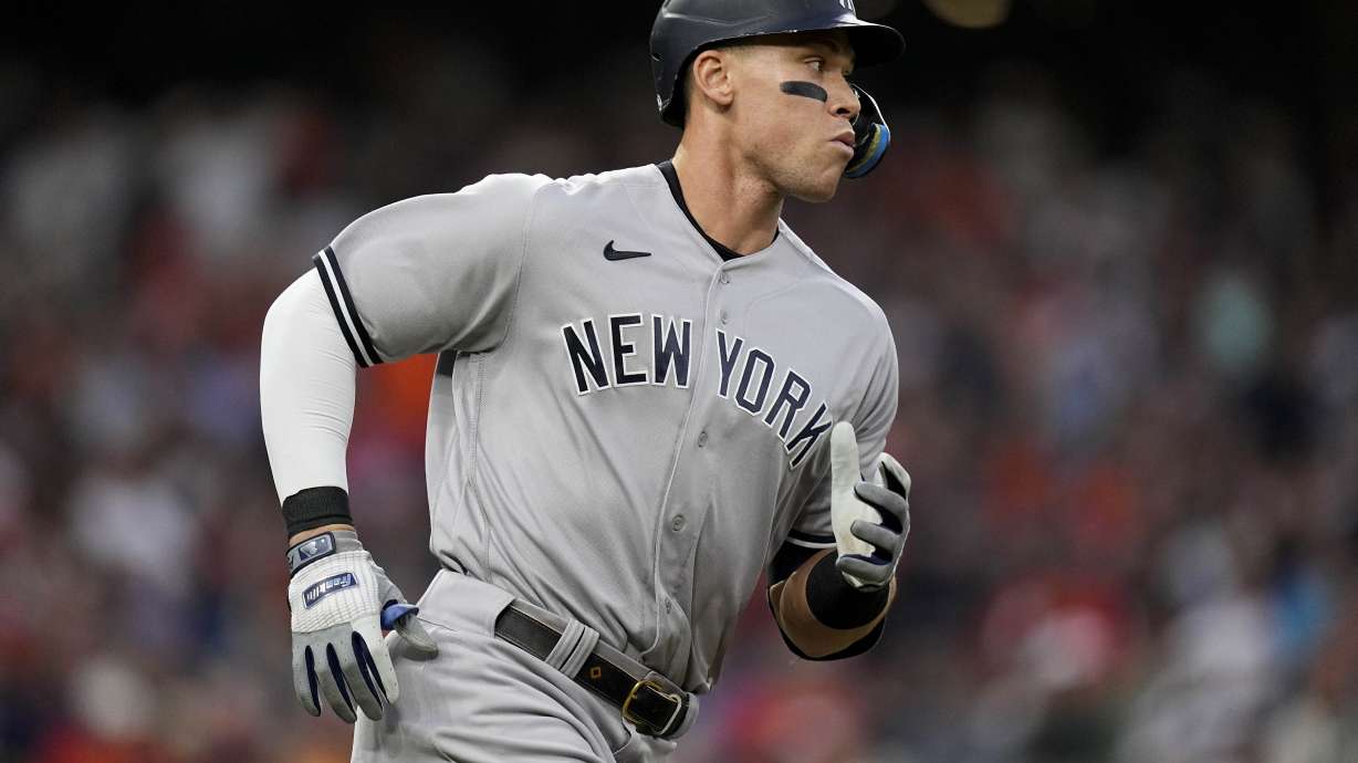 New York Yankees Aaron Judge (99) watches his ball fly out during the first inning in Game 2 of baseball's American League Championship Series between the Houston Astros and the New York Yankees, Thursday, Oct. 20, 2022, in Houston.