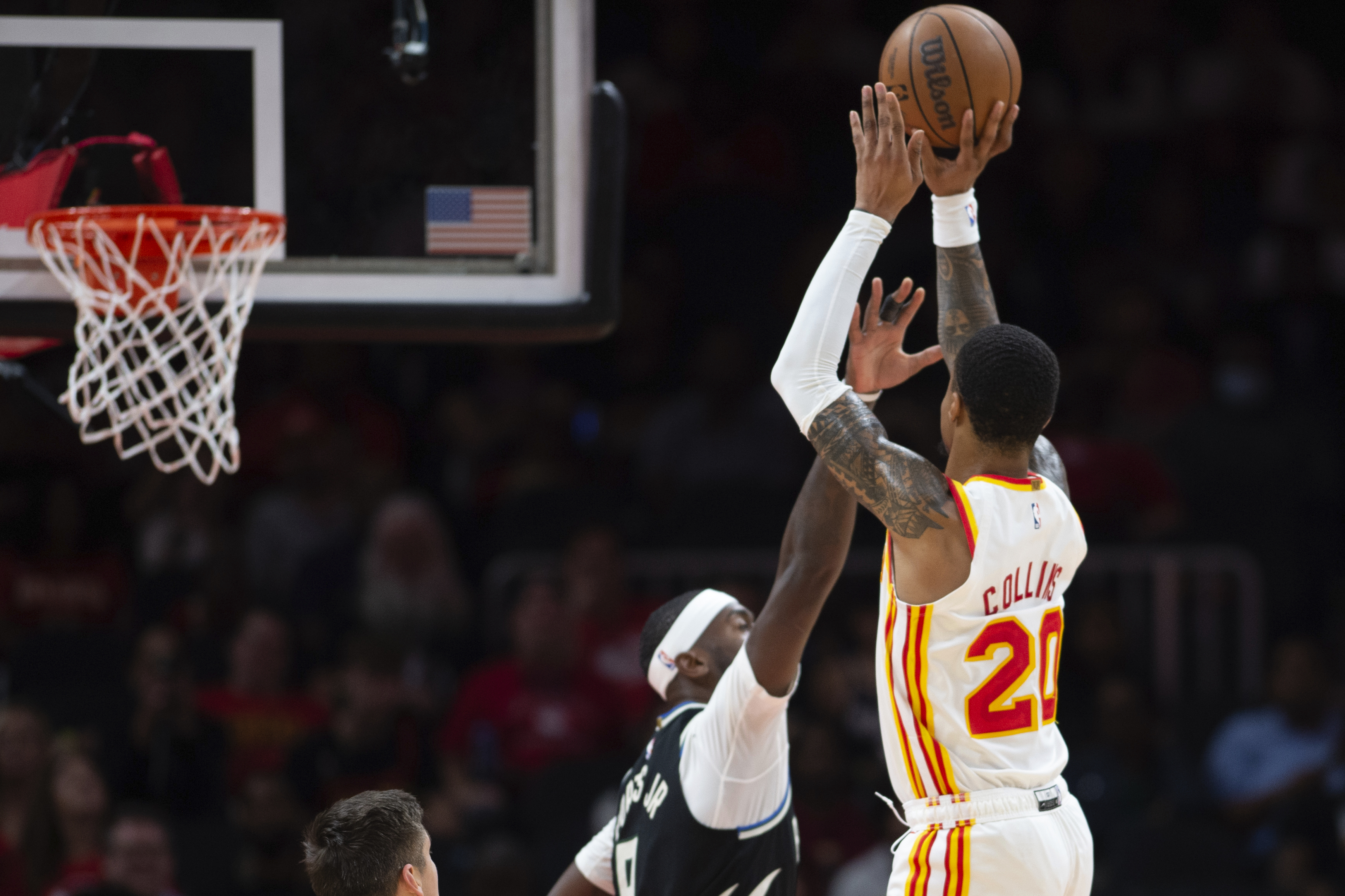Atlanta Hawks' John Collins shoots over Milwaukee Bucks' Bobby Portis Jr. during the first half of an NBA basketball game Monday, Nov. 7, 2022, in Atlanta. 