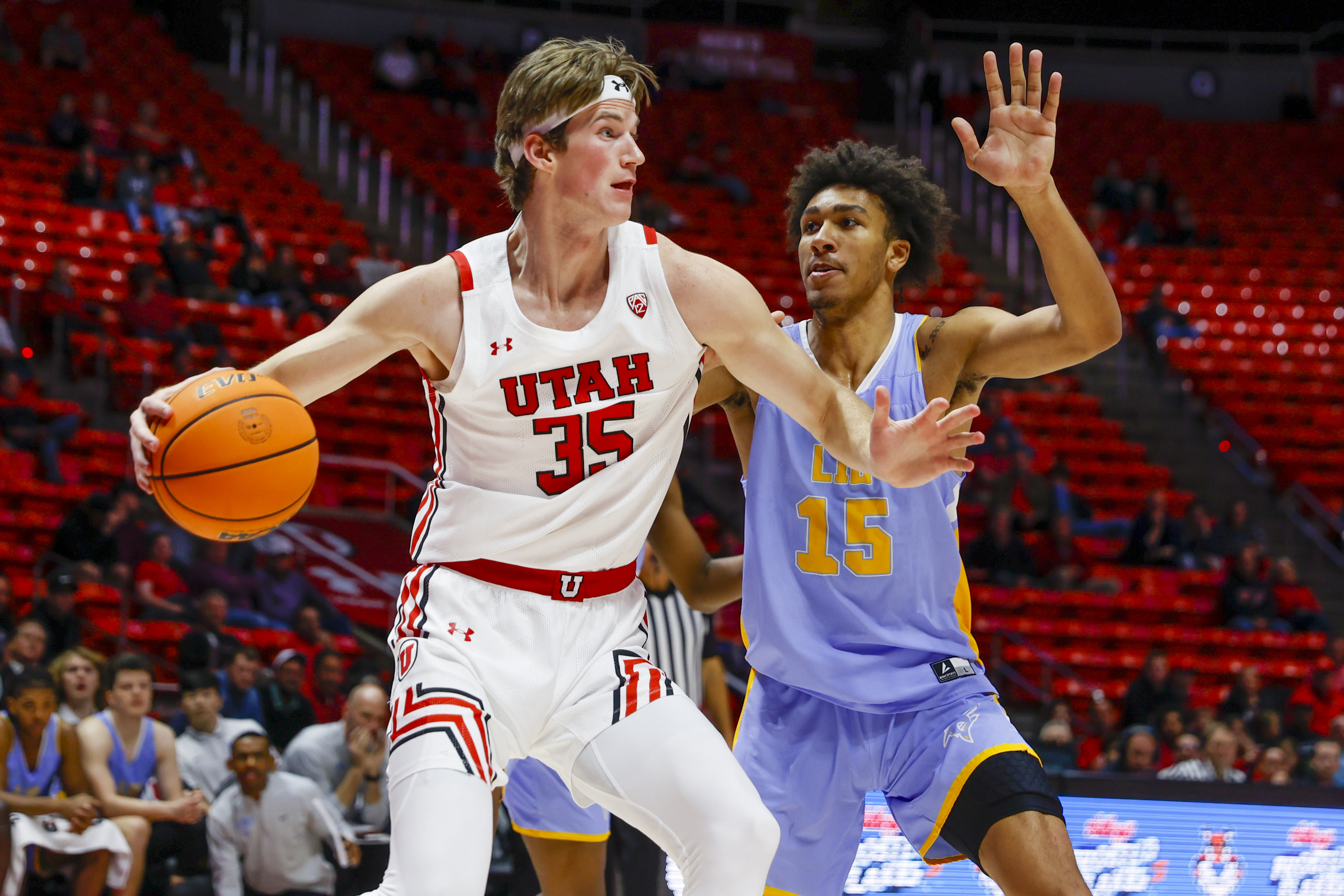 Carlson scores 21 as Utah overwhelms Long Island to earn 89-48 season-opening win