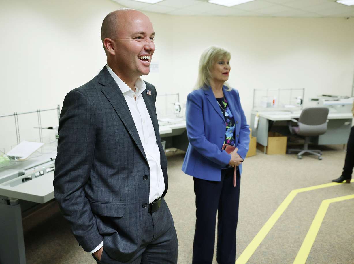 Gov. Spencer Cox and Salt Lake County Clerk Sherrie Swensen look over the Salt Lake County Clerk’s ballot processing room on Election Day in Salt Lake City on Tuesday.