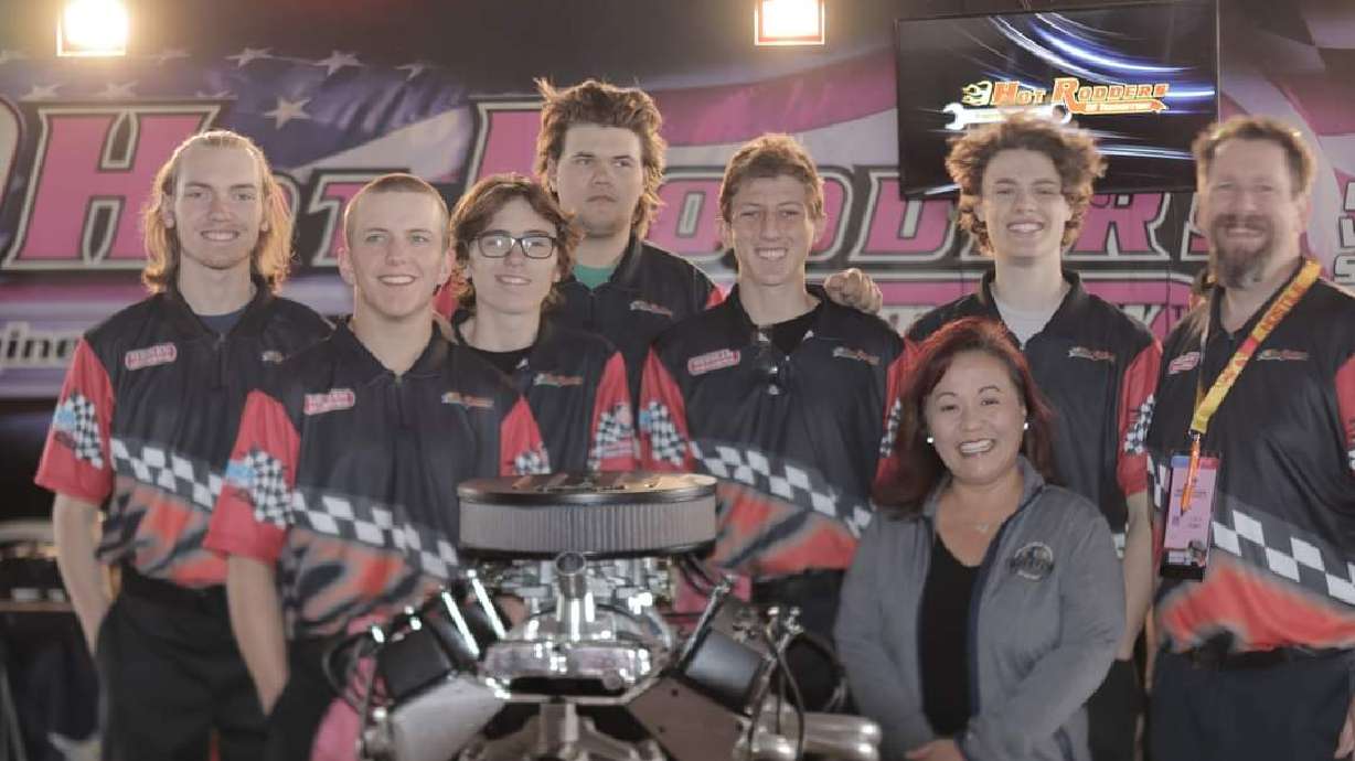 Jacob Fluckiger, Kaden Astle, Lincoln Henderson, Coby Sandberg, Isaac Kobbeman, Nolan Brauer, instructor Adam Arndt and State CTE Specialist Kristina Yamada celebrate Bonneville High School's recent auto shop program award.