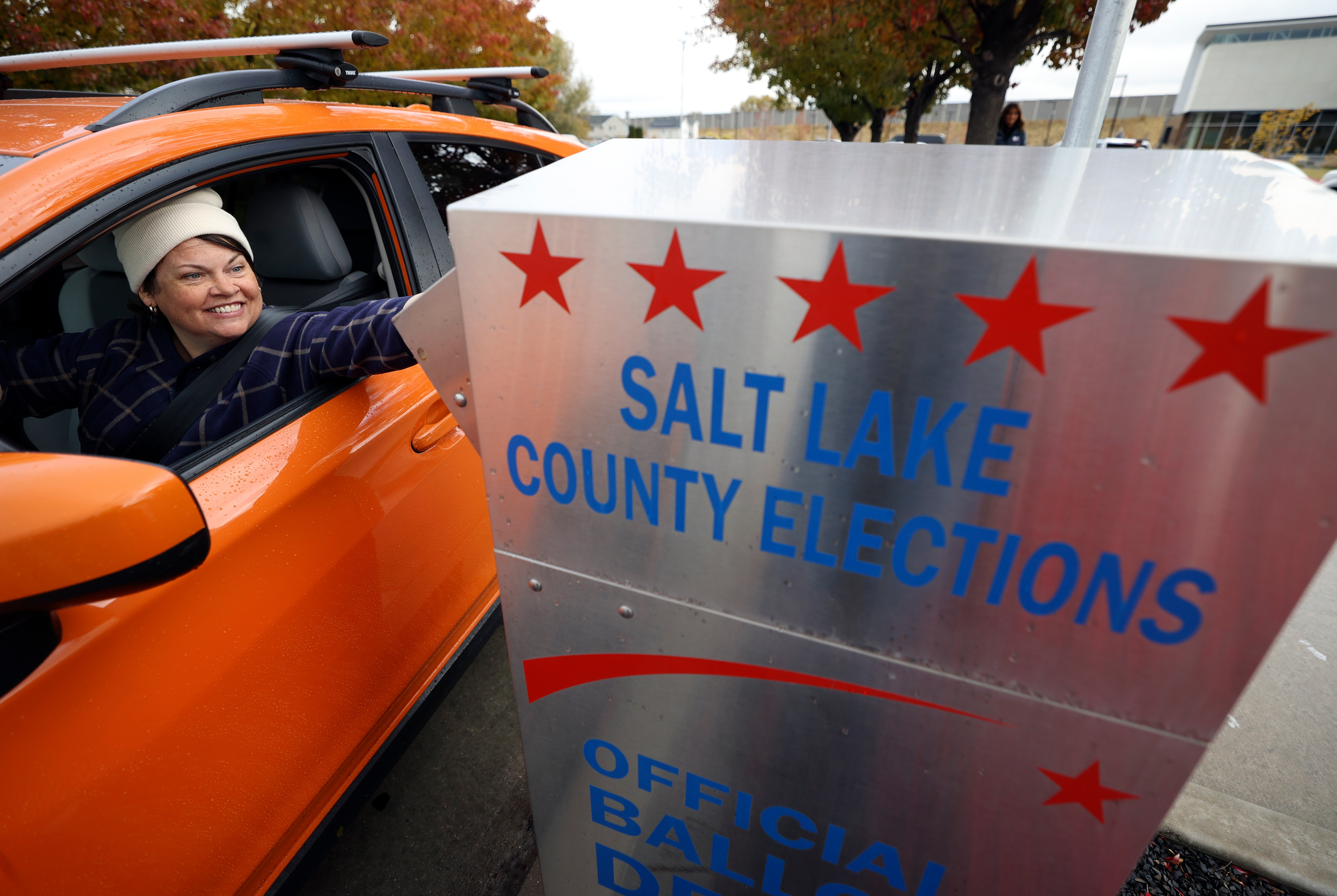 Amy Robinson drops her ballot into a box outside Taylorsville City Hall in Taylorsville on Election Day Tuesday.