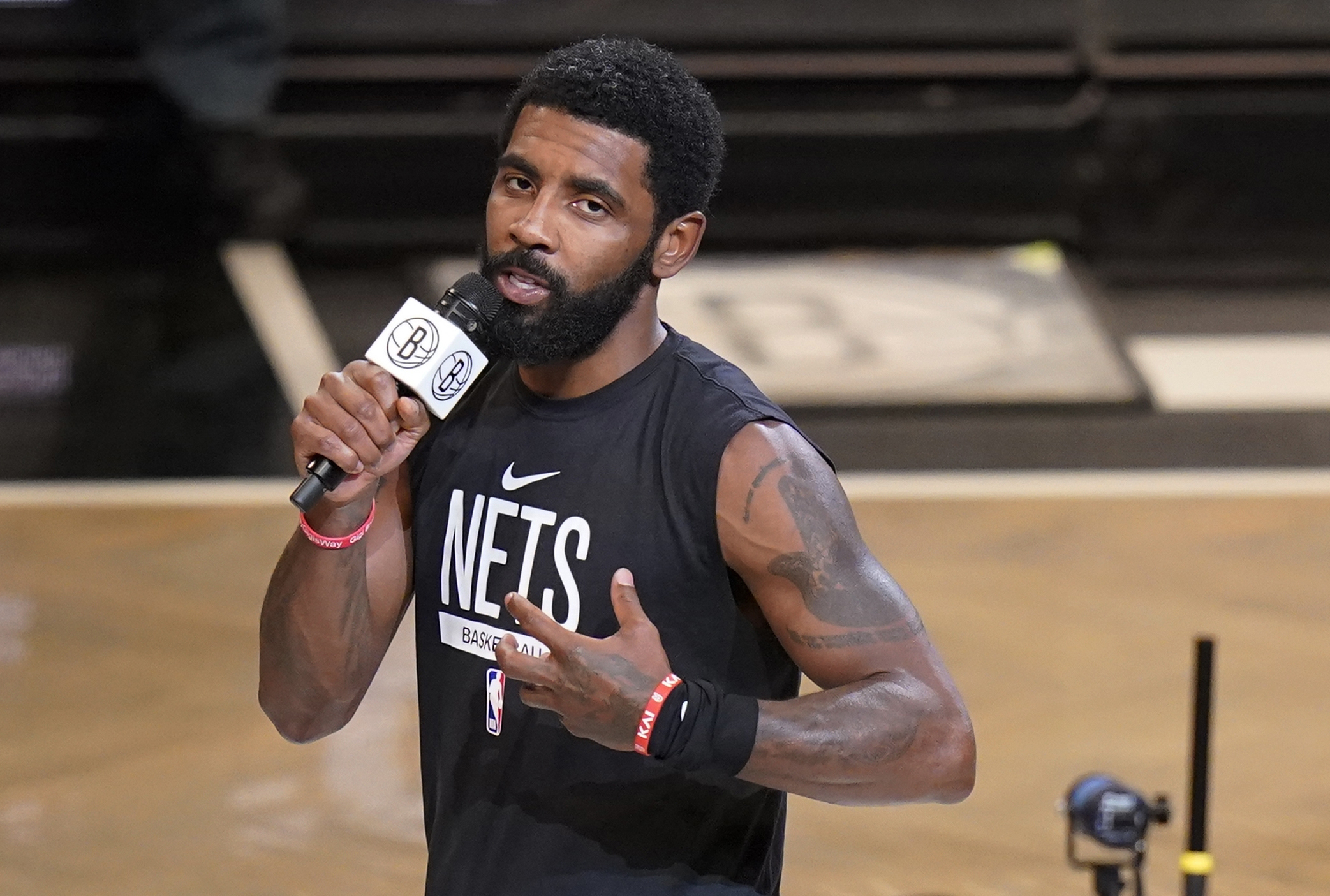 FILE - Brooklyn Nets' Kyrie Irving speaks before the team's NBA basketball game against the New Orleans Pelicans on Oct. 19, 2022, in New York. The Nets are suspending Irving for at least five games without pay, saying they were dismayed by his failure to “unequivocally say he has no antisemitic beliefs.” Hours after Irving refused to issue the apology that NBA Commissioner Adam Silver sought for posting a link to an antisemitic work on his Twitter feed, the Nets said that Irving is “currently unfit to be associated with the Brooklyn Nets.” 