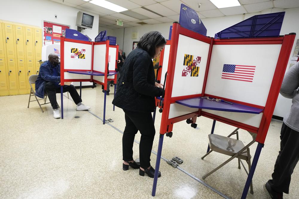 People fill out ballots during early voting at Westside Skill Center, Oct. 31 in Baltimore, Md. Midterm elections are being held on Tuesday.