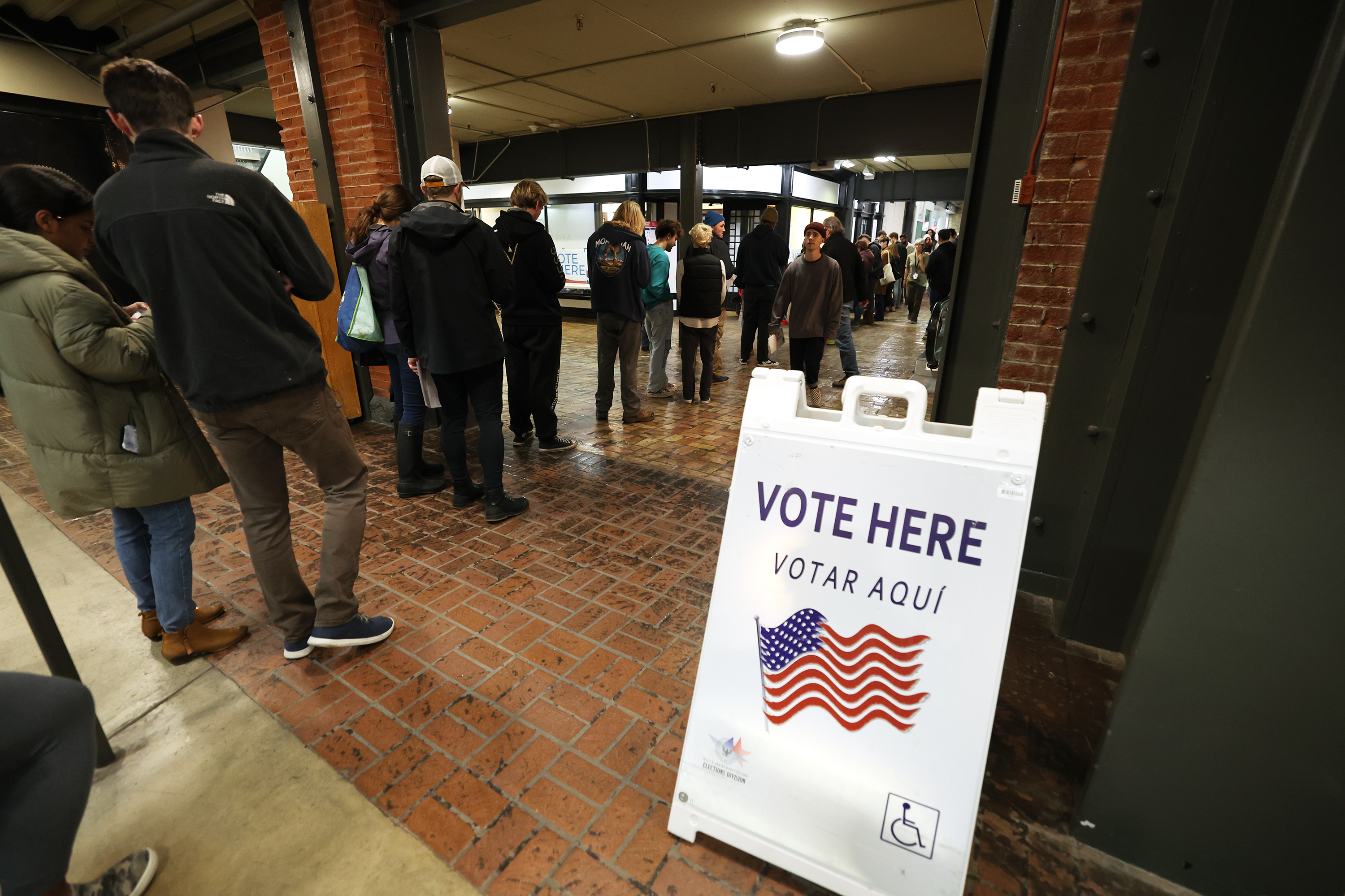 Voters line up at Trolley Square in Salt Lake on Tuesday. Orem splitting from Alpine School District to form its own district and a $475 million bond for Davis School District were two of the most discussed issues in education leading up to election day. Here's where they stand after preliminary voting results.